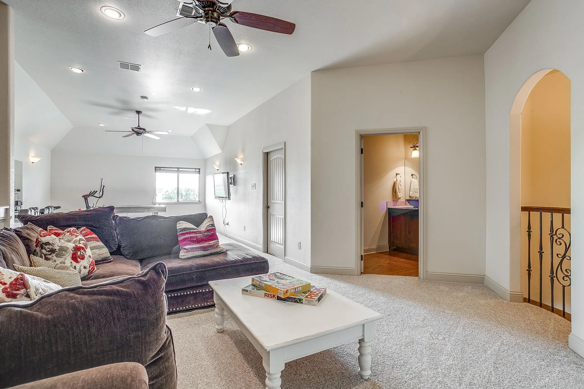 Upstairs bonus room with vaulted ceiling, recessed lighting, and ceiling fans