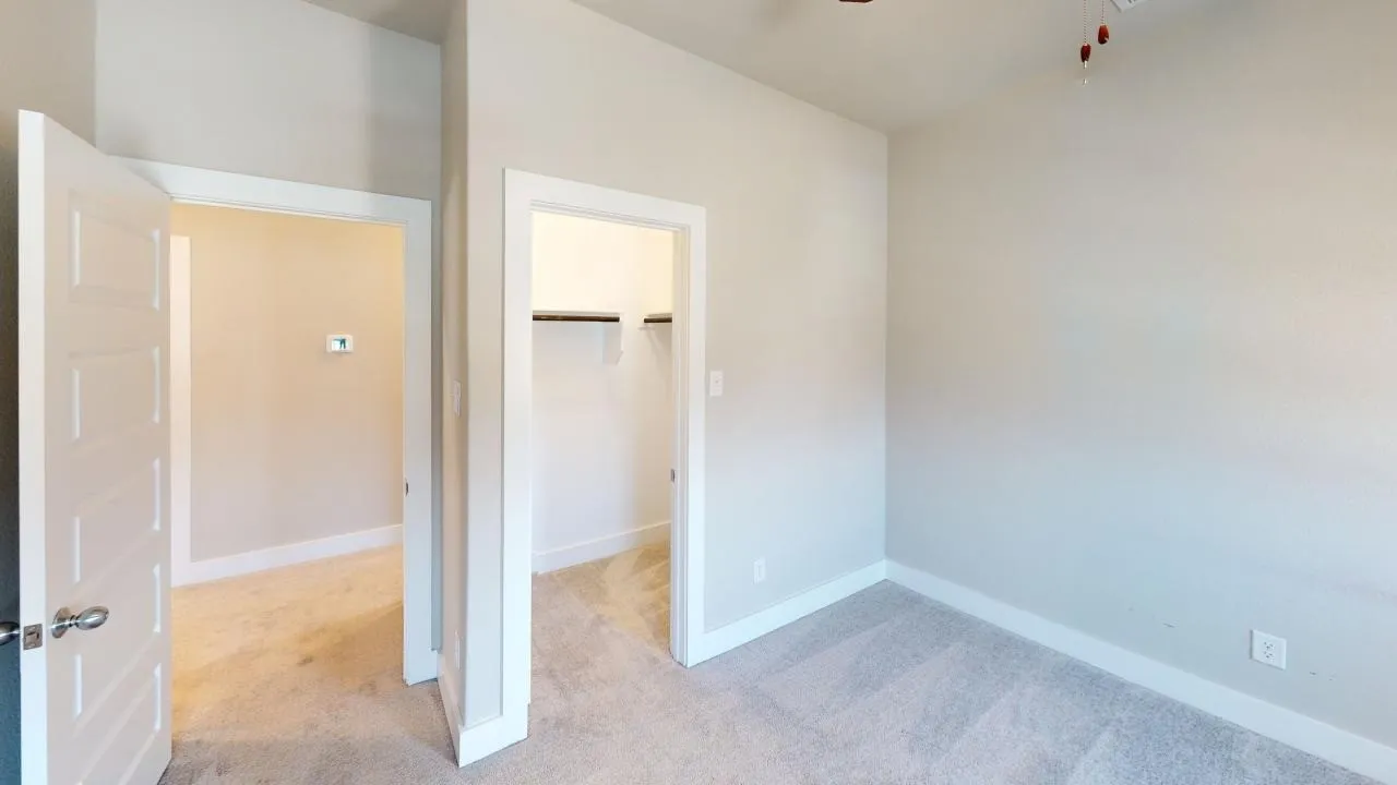 Neutral-toned walls and carpeted flooring