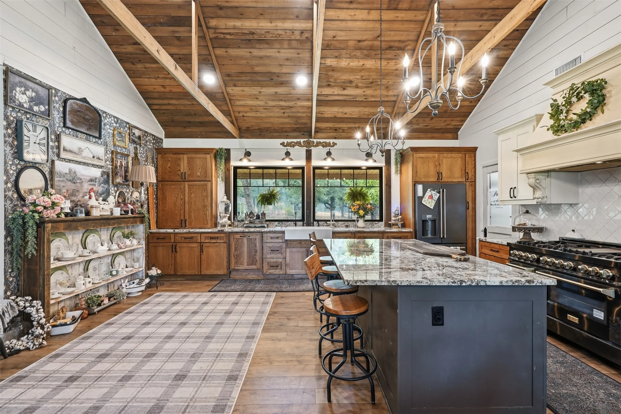 large island with seating, butler pantry, commercial grade stove and much more