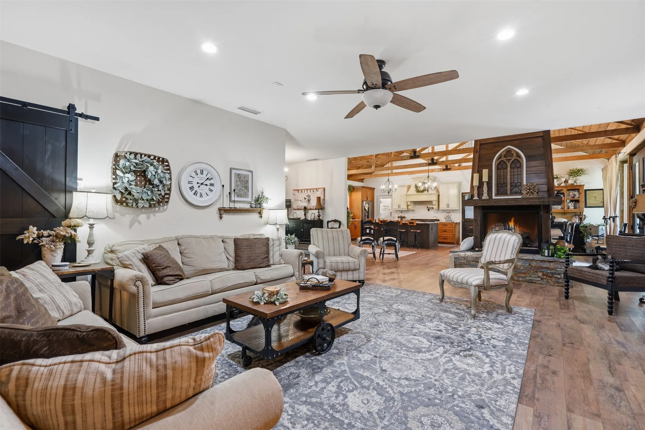family room open to entry and kitchen with see thru fireplace