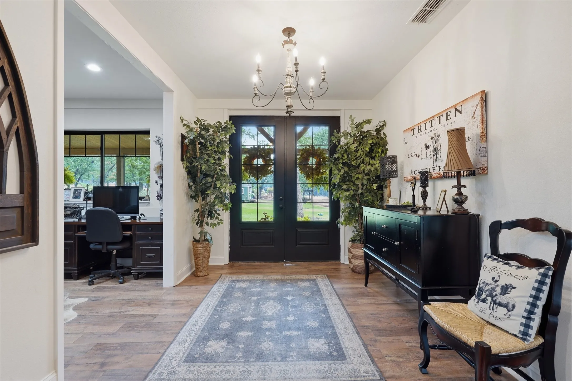 entry way with double doors, decorative lighting