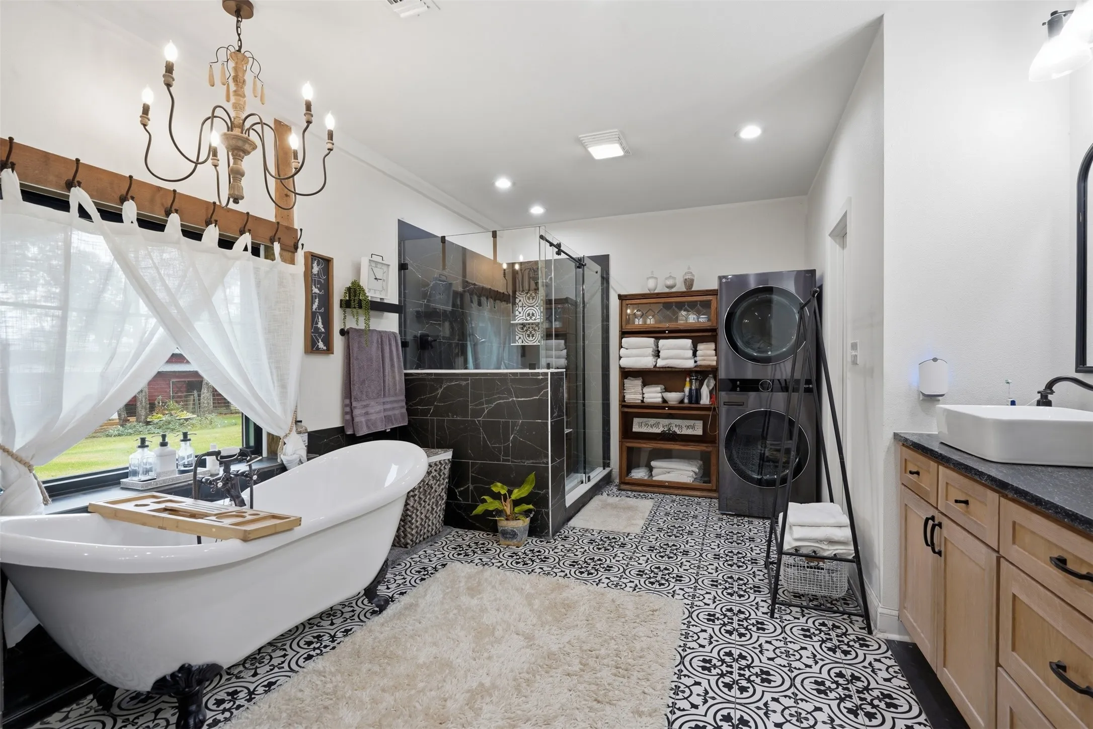 oversized master bath with even a stackable washer and dryer unit
