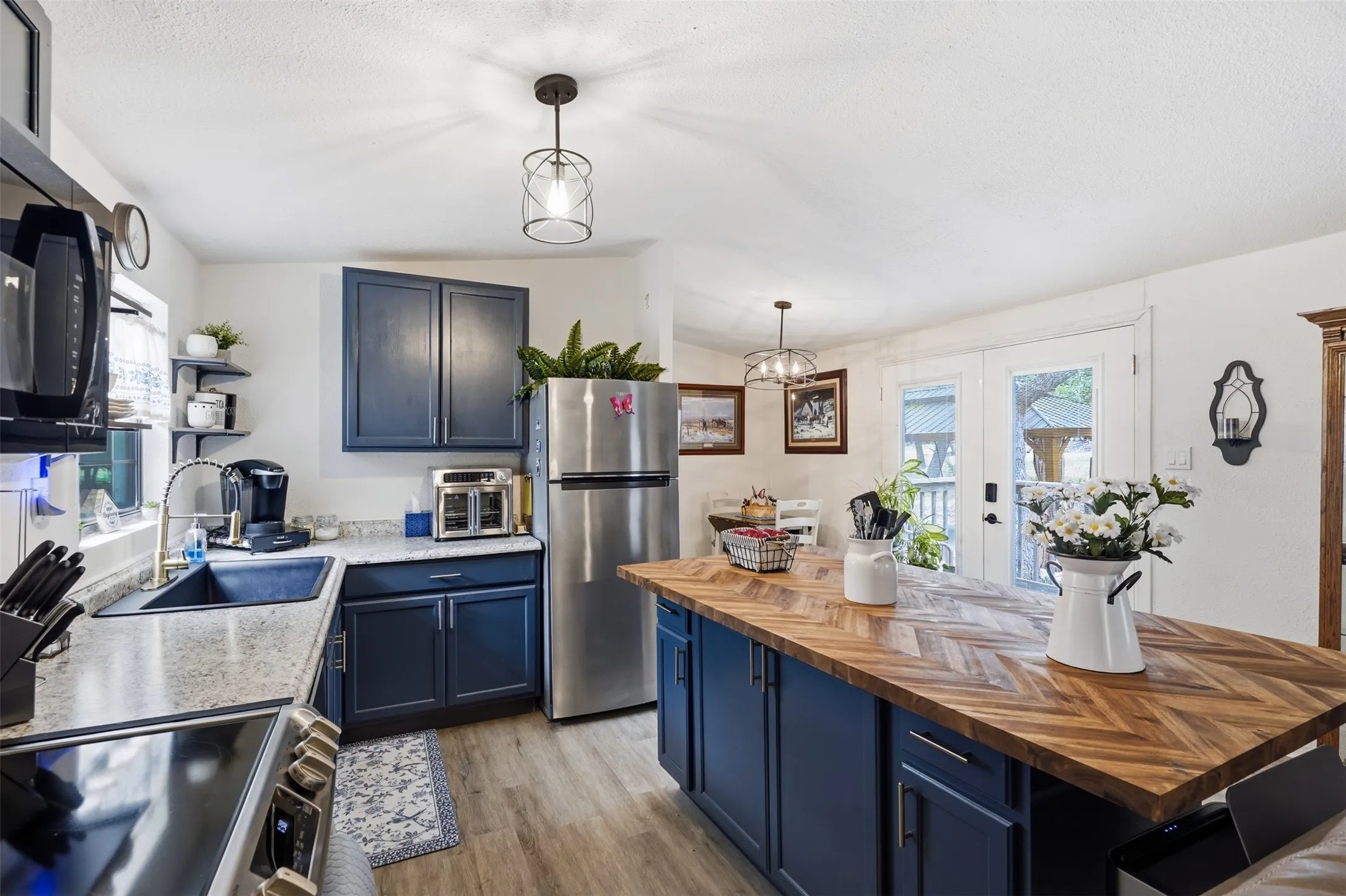 island and kitchen with built in appliances