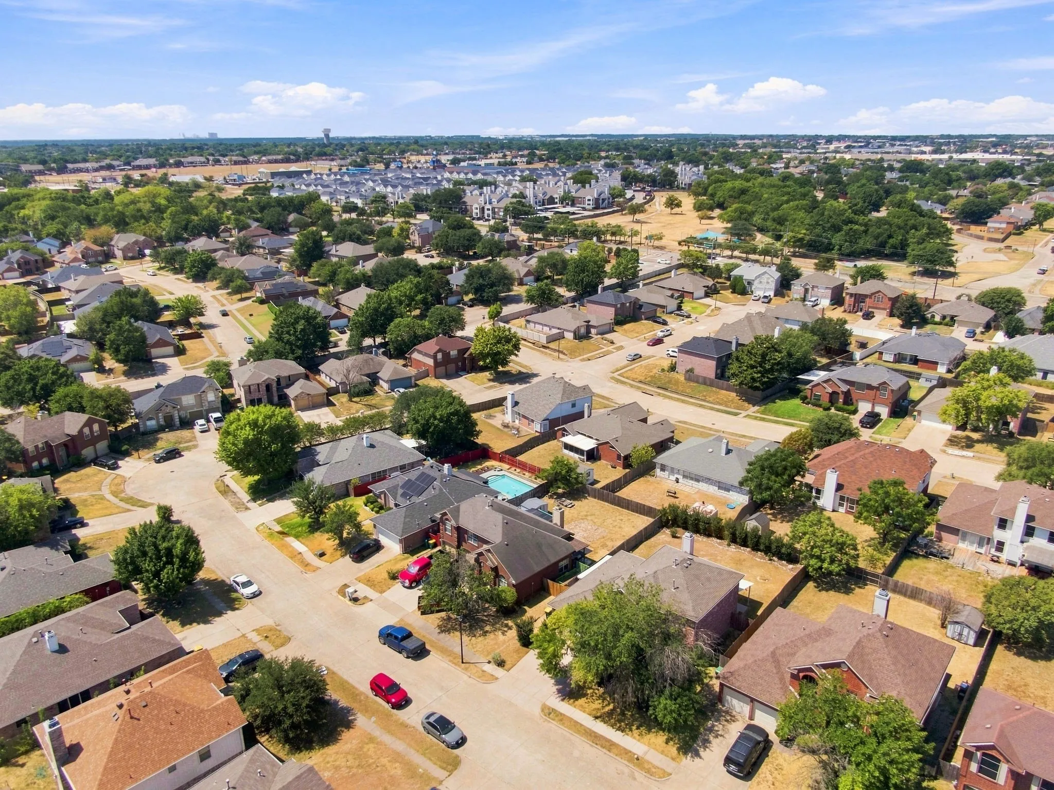 Residential neighborhood with varied architectural styles and mature trees