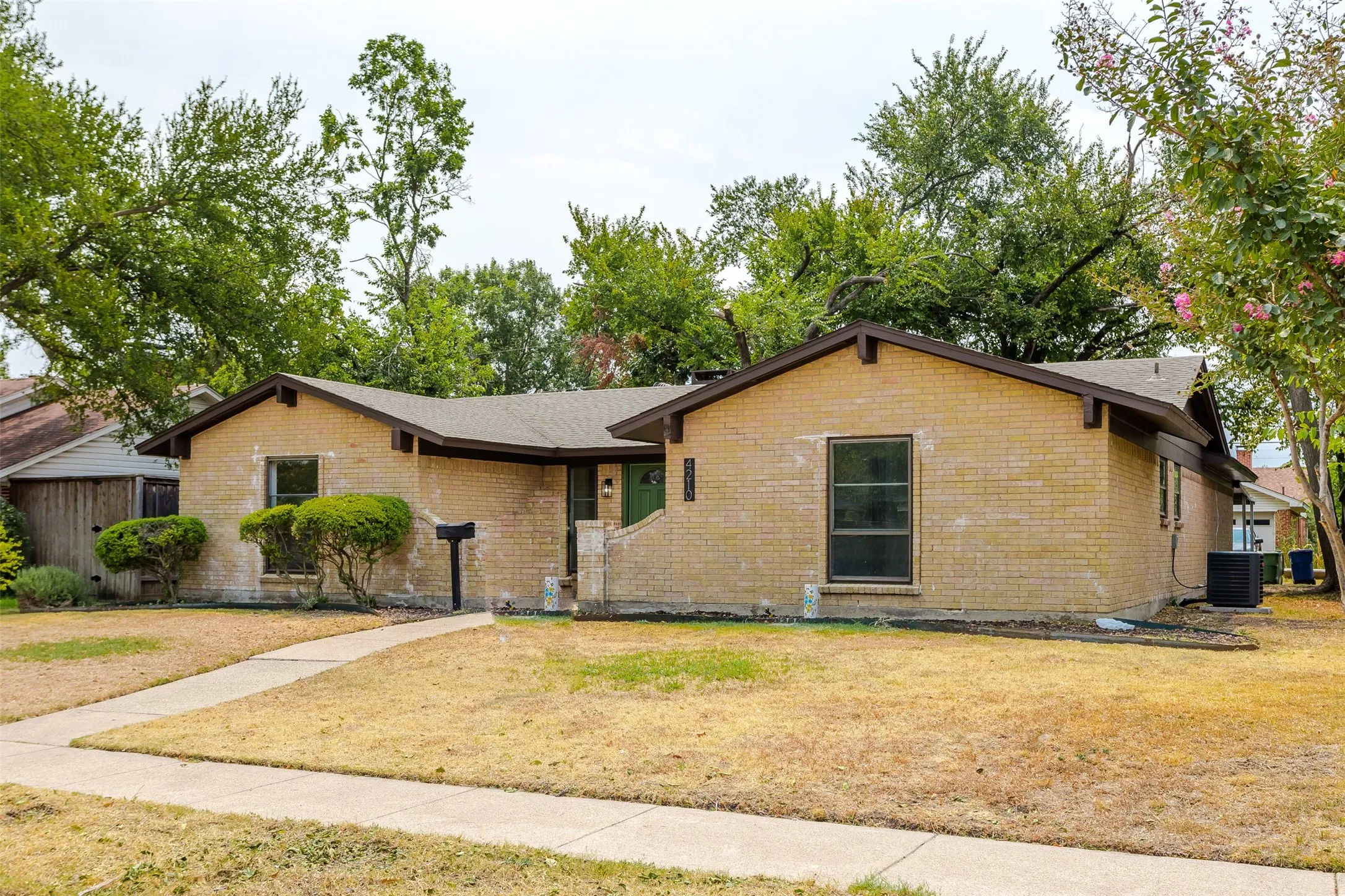 Brick exterior with a gabled roof and dark trim
