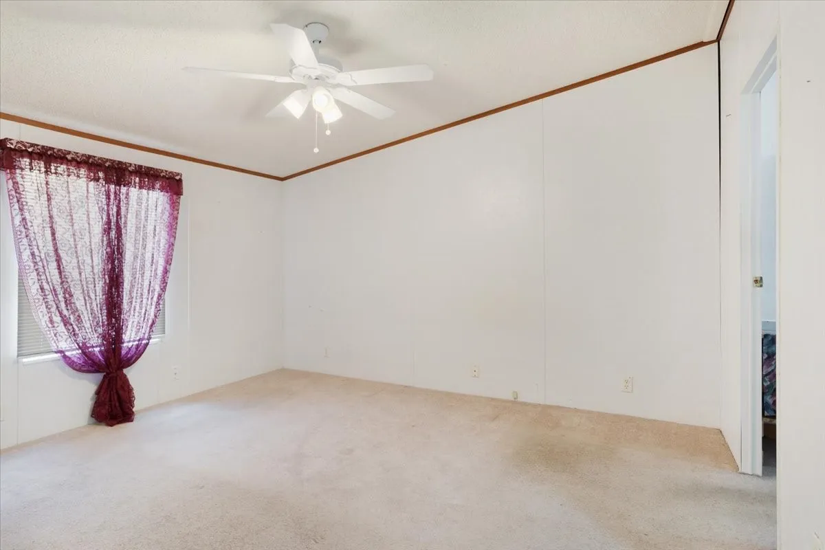 Closet and primary ensuite bath to the right
