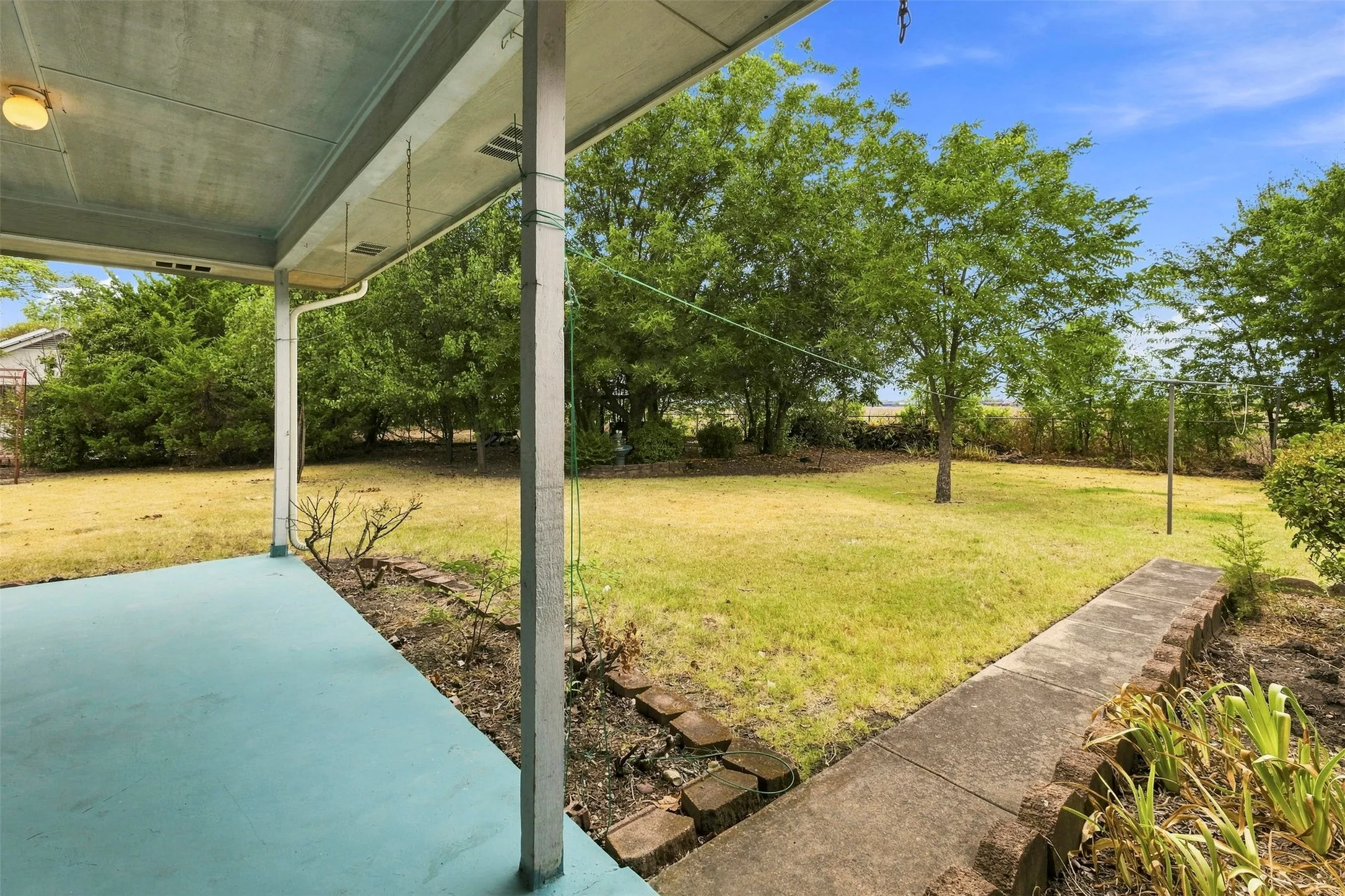 This area is just waiting for you to make it your own back yard retreat.