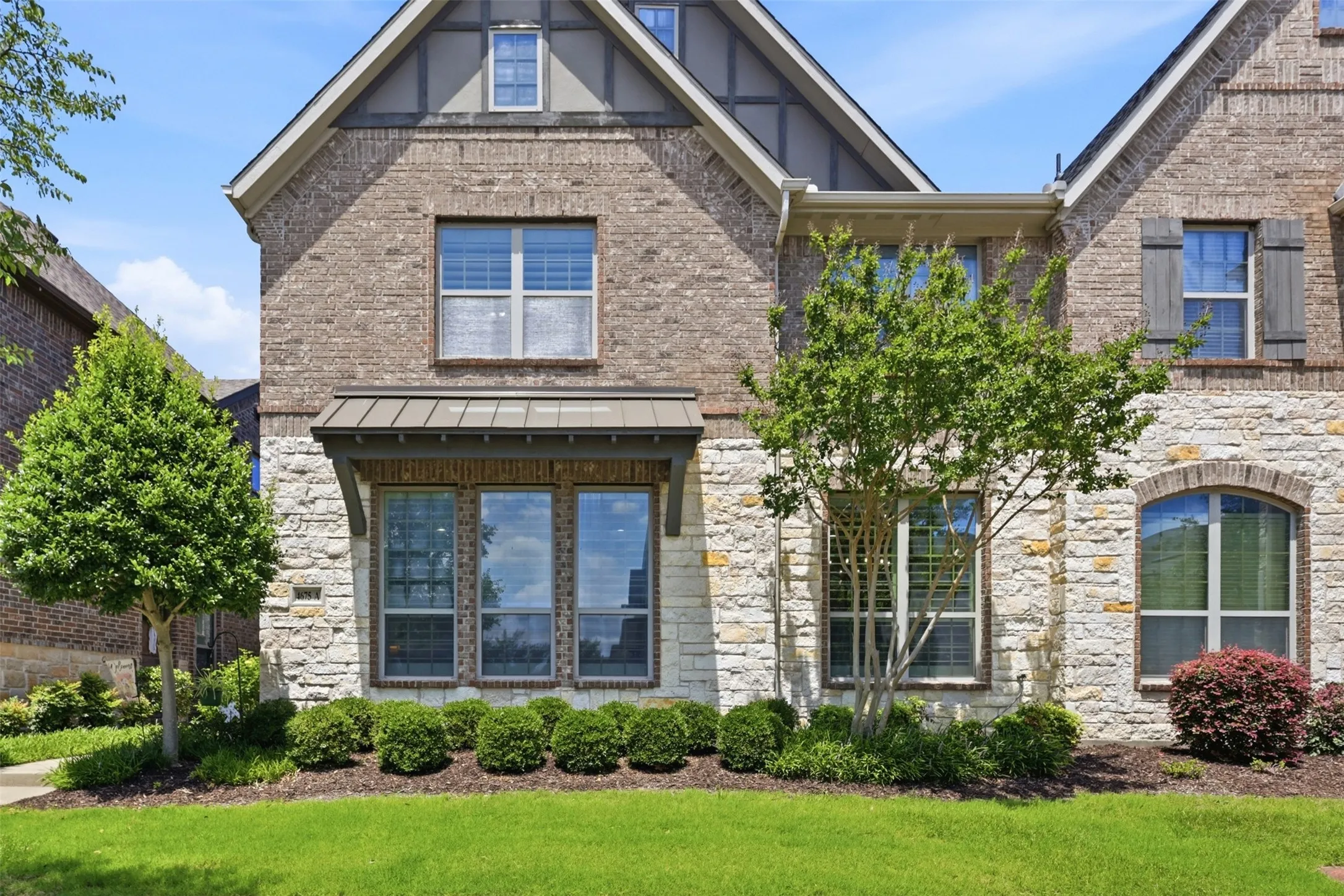 Brick and stone exterior with gabled roof lines