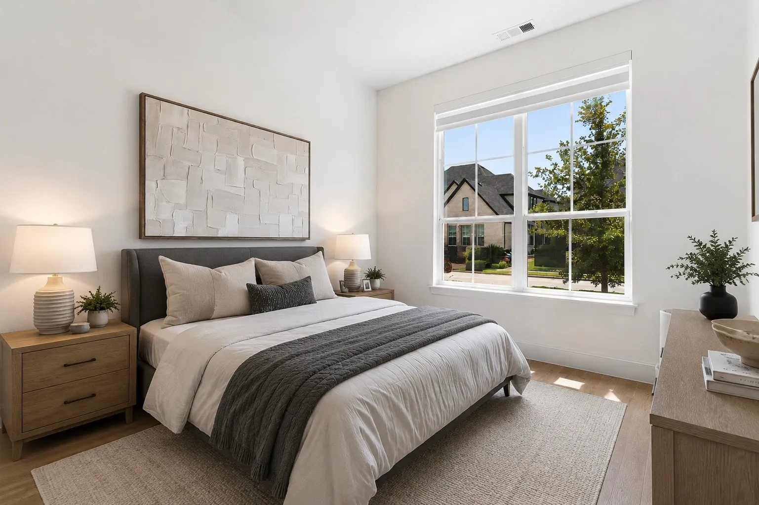 Hardwood-style flooring with a large window