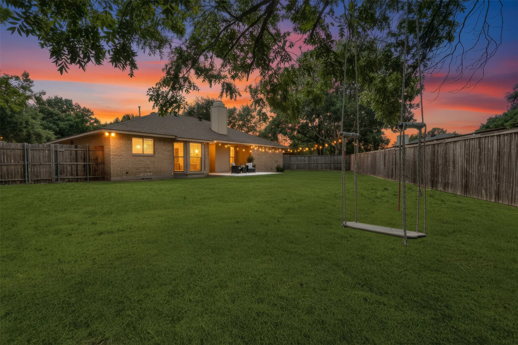 Views from a different angle of the backyard  - tire swing and a look at the oversized yard and new patio space