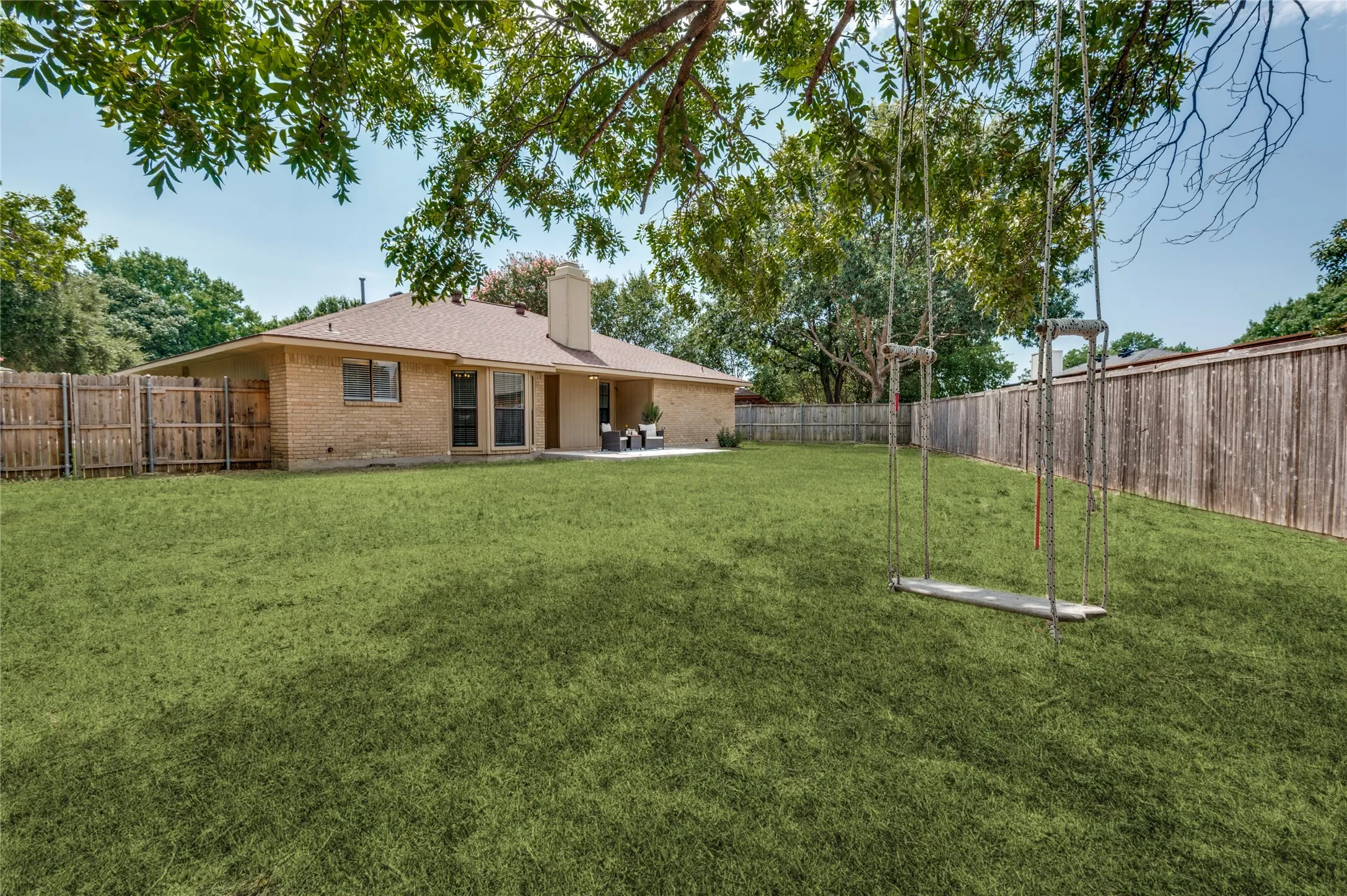 Views from a different angle of the backyard  - tire swing and a look at the oversized yard and new patio space