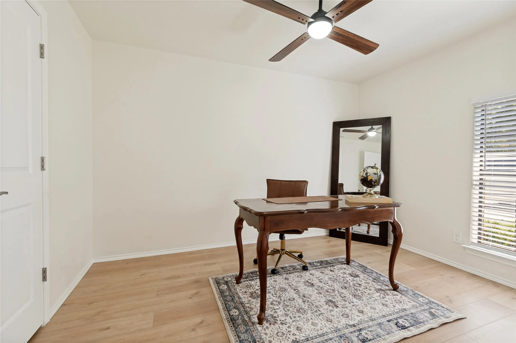 Front-yard facing bedroom with WALK-IN CLOSET, fresh paint, and new floors/windows/and remote-controlled ceiling fan