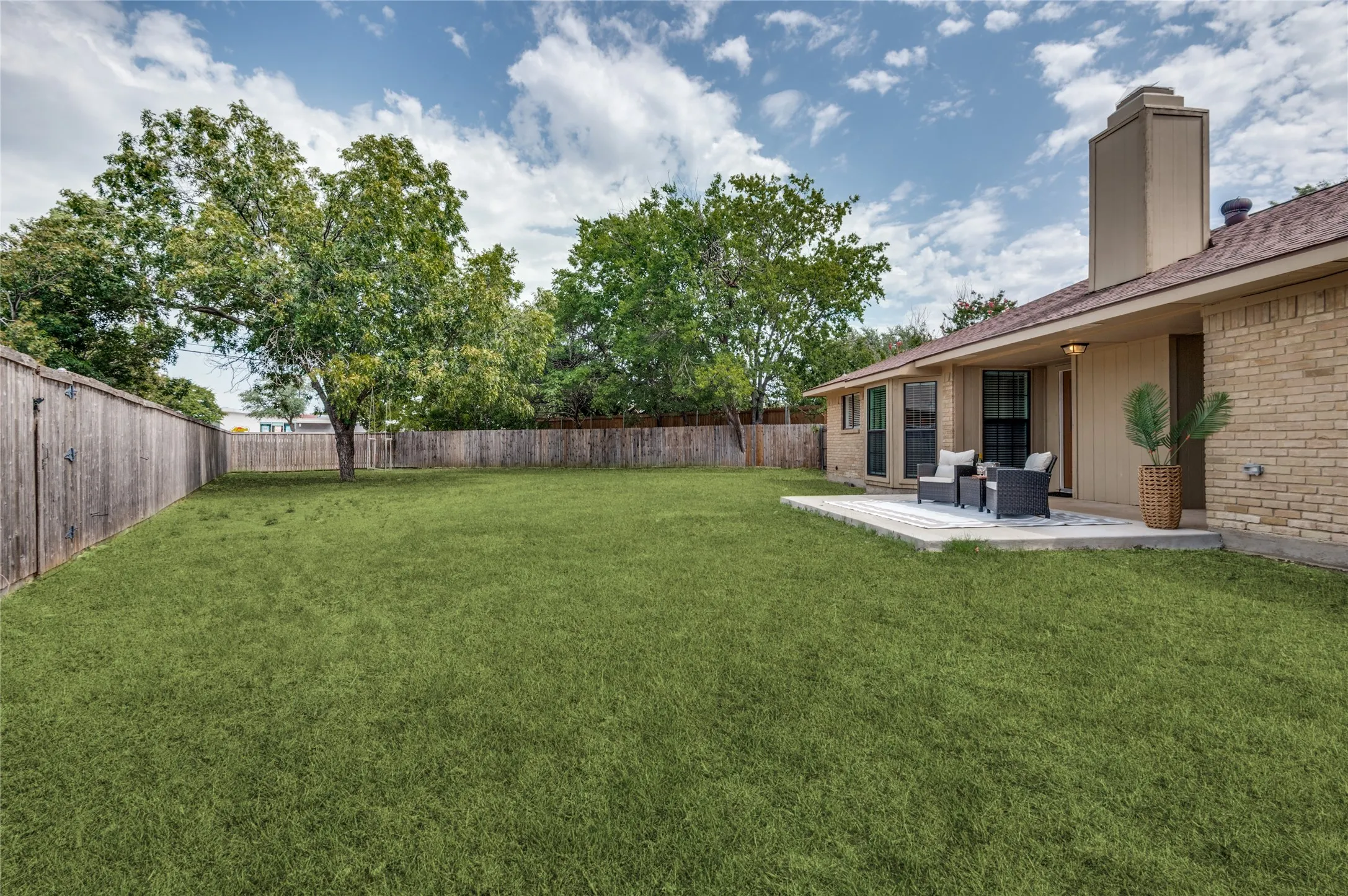 Oversized backyard with views of the newly-installed patio