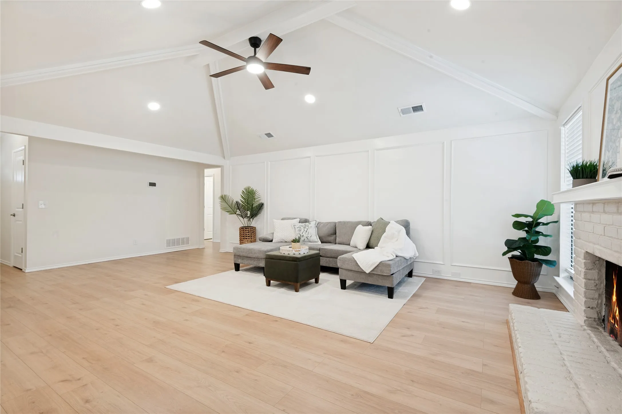Beautifully updated living room with freshly painted walls, ceilings and fireplace just waiting for its new family to enjoy!