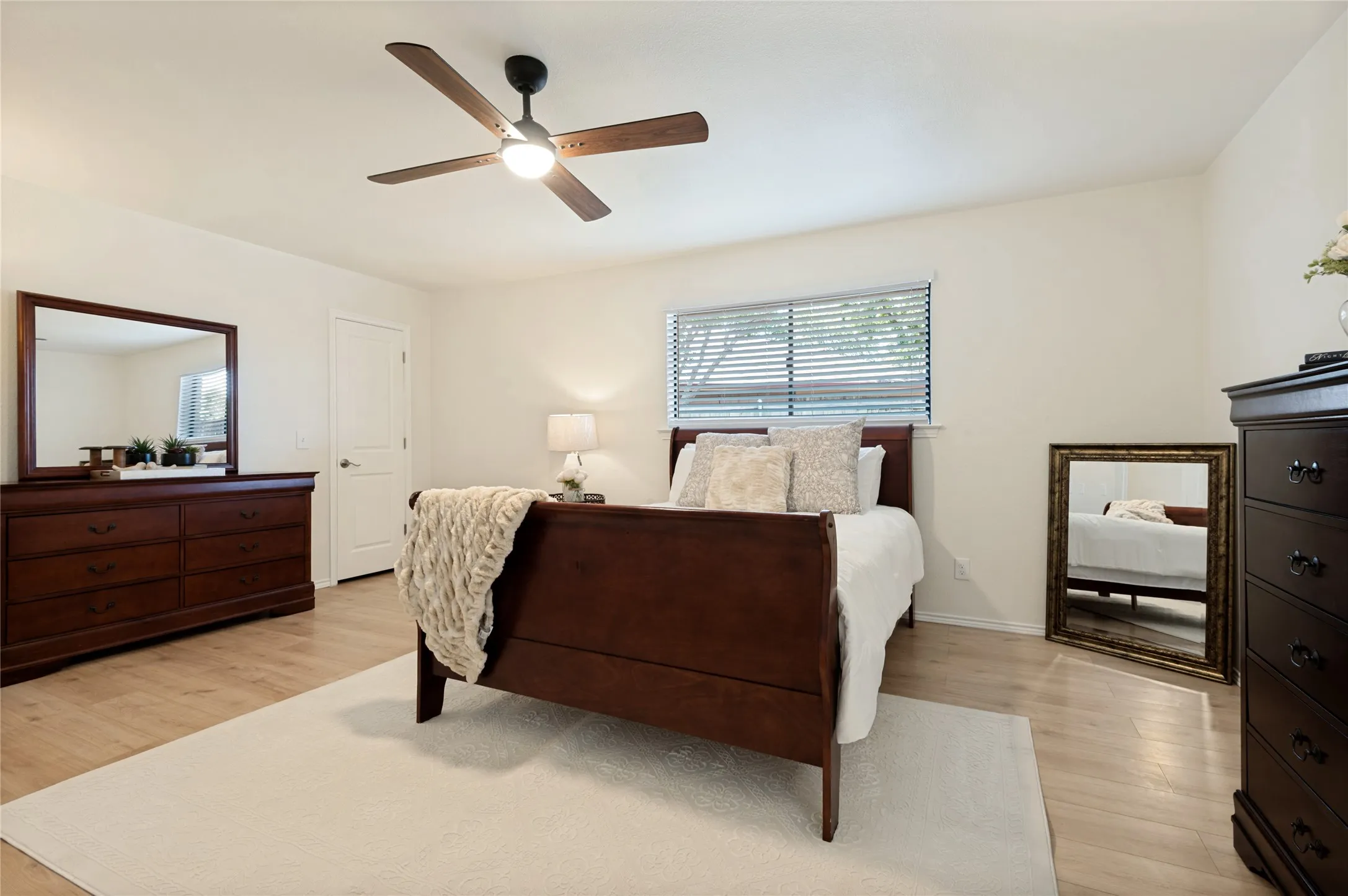 Primary Bedroom Ensuite with natural lighting and a view of 1 of the 3 walk-in closets
