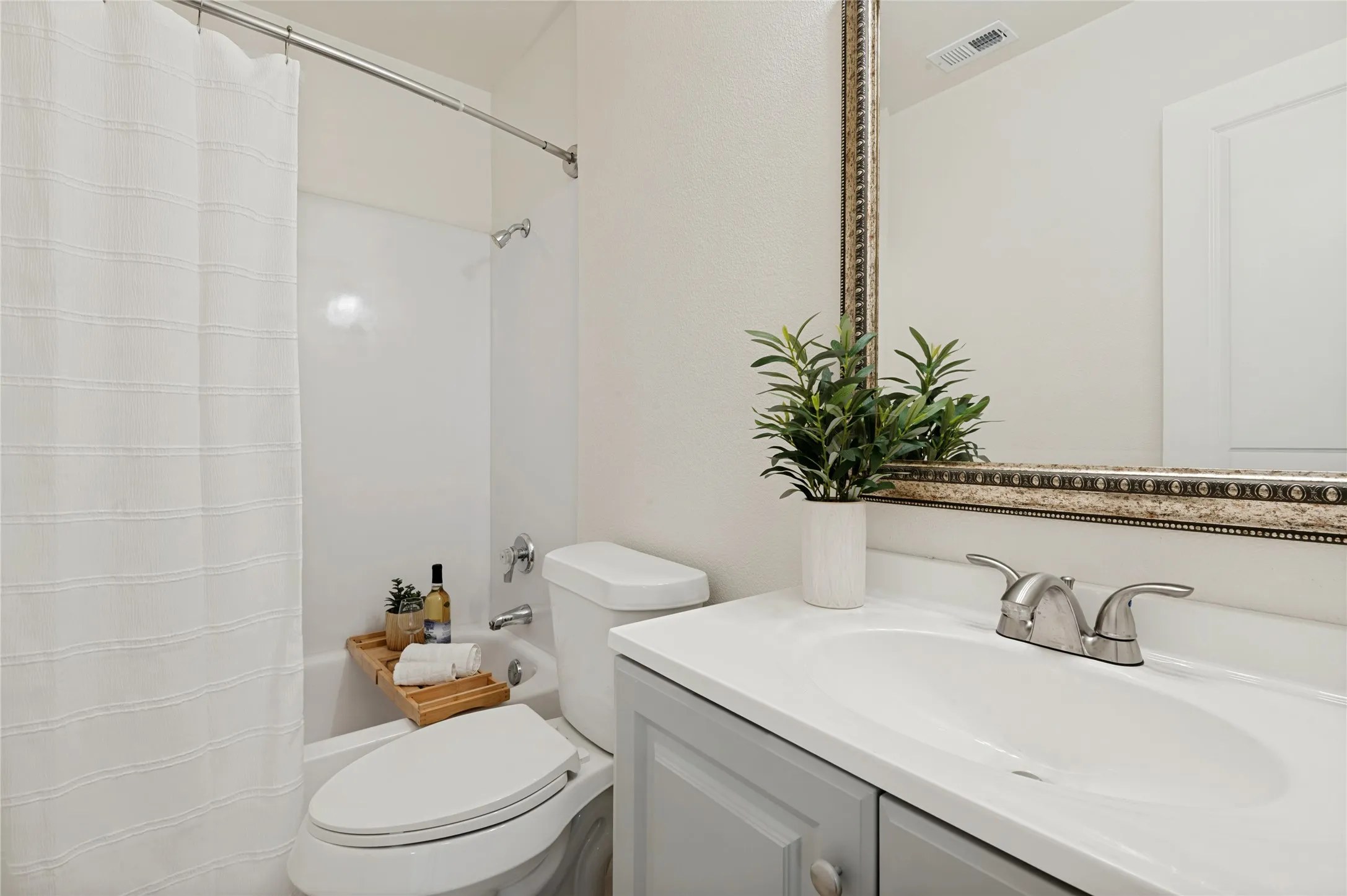 Perfectly-appointed FULL bathroom:  shower/bathtub combination, new granite countertop with storage, fresh paint and new toilet
