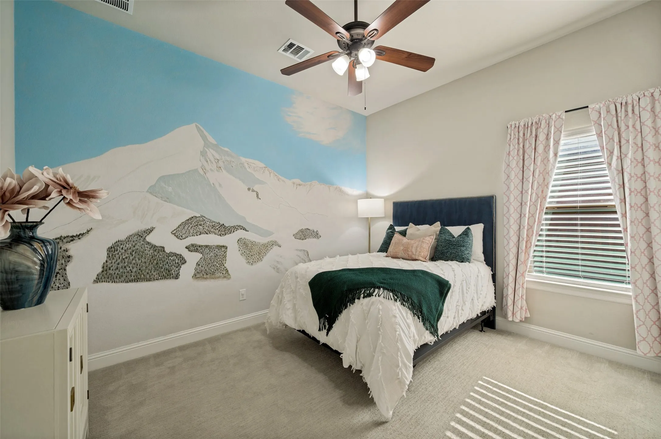 A well-appointed downstairs bedroom offers comfort and privacy for guests or multigenerational living, complete with generous proportions, soft natural light, and easy access to a full bath. Thoughtfully positioned on the main level, this versatile space is ideal for overnight visitors, extended family.