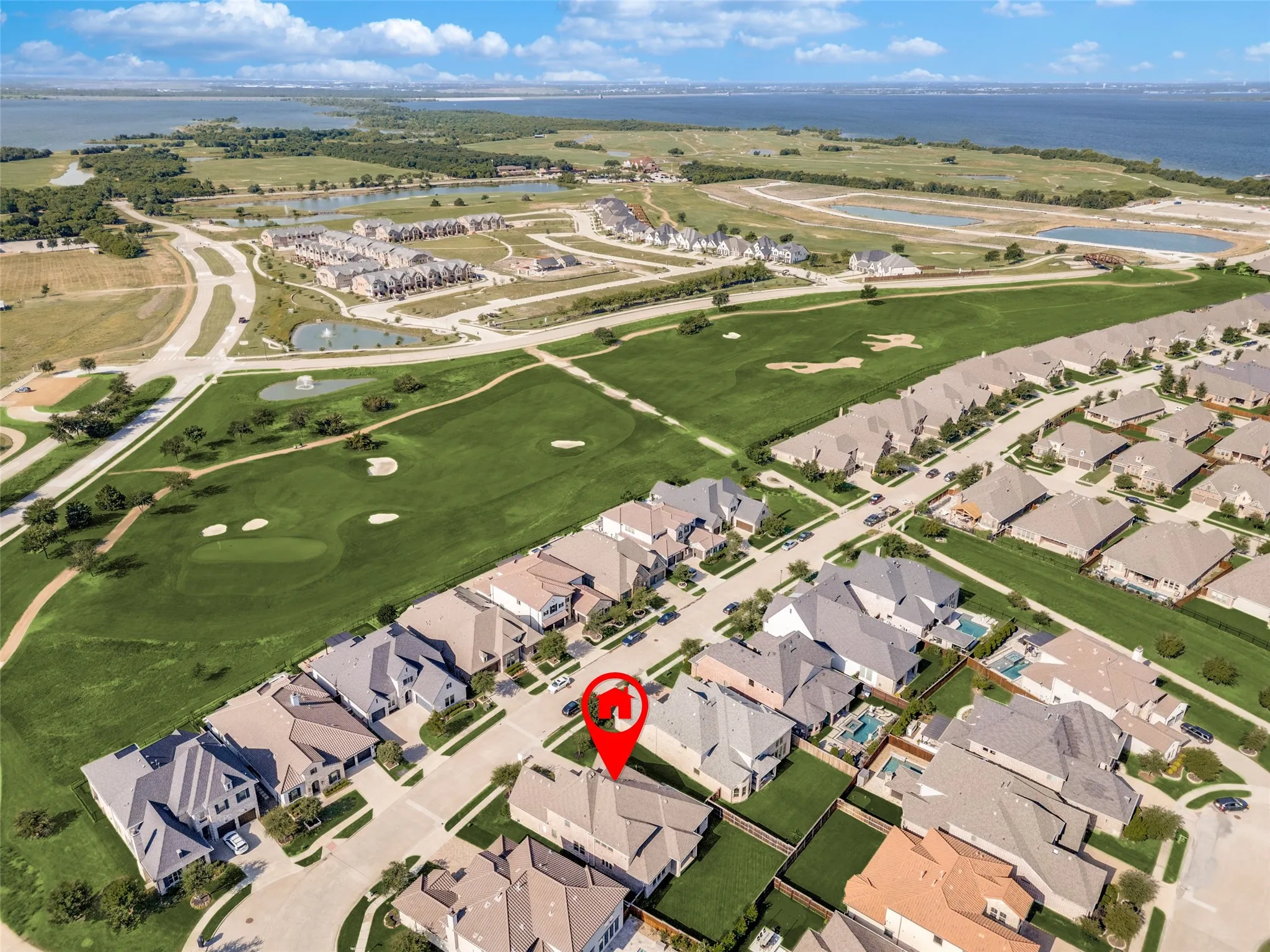 Enjoy spectacular golf course views and resort-style living in The Tribute Lake & Golf Resort Community, featuring championship golf, Lake Lewisville, scenic trails, pools, parks, pickleball courts, and exceptional community amenities.