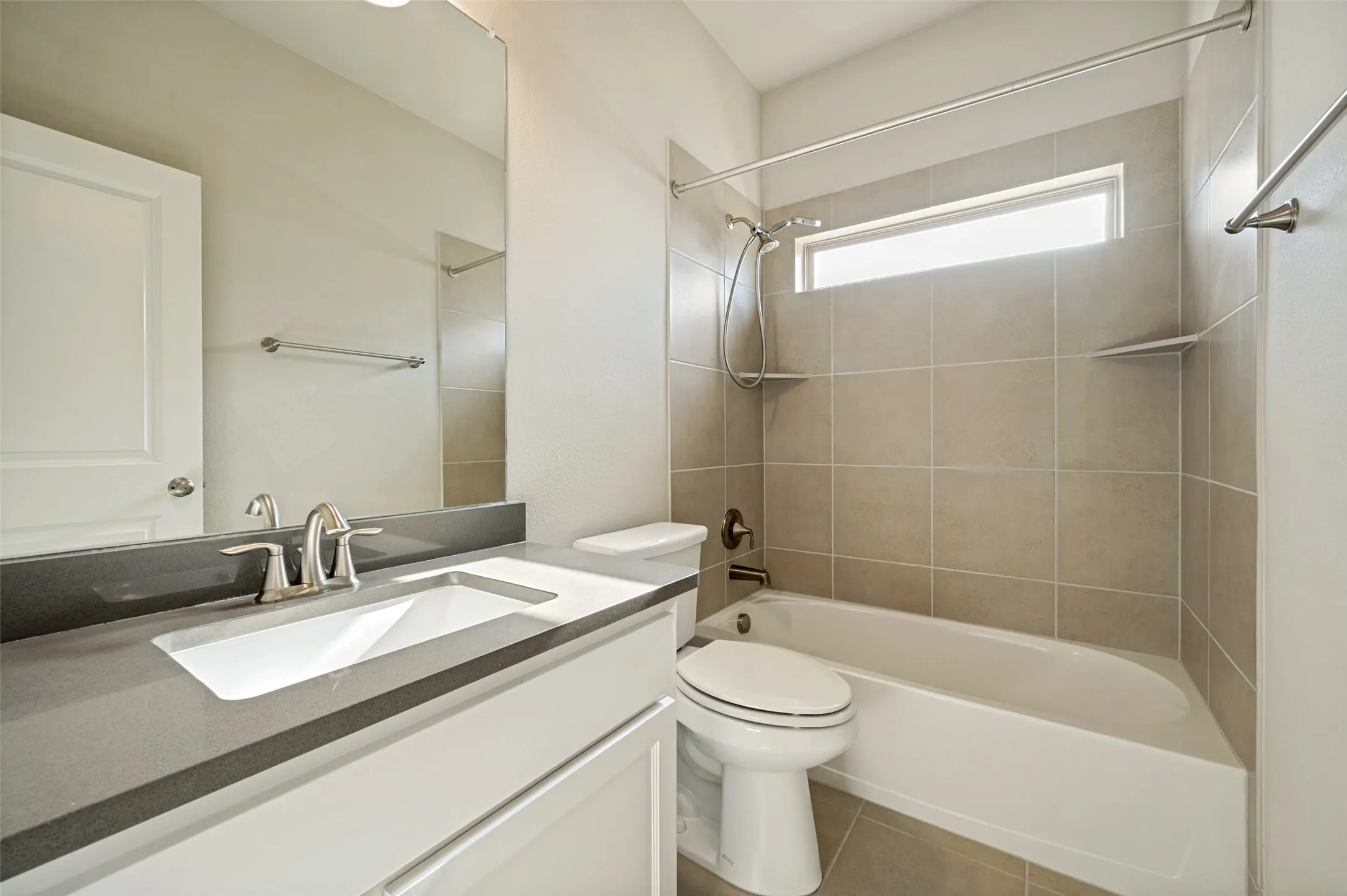 A well-appointed downstairs bedroom offers comfort and privacy for guests or multigenerational living, complete with generous proportions, soft natural light, and easy access to a full bath. Thoughtfully positioned on the main level, this versatile space is ideal for overnight visitors, extended family.