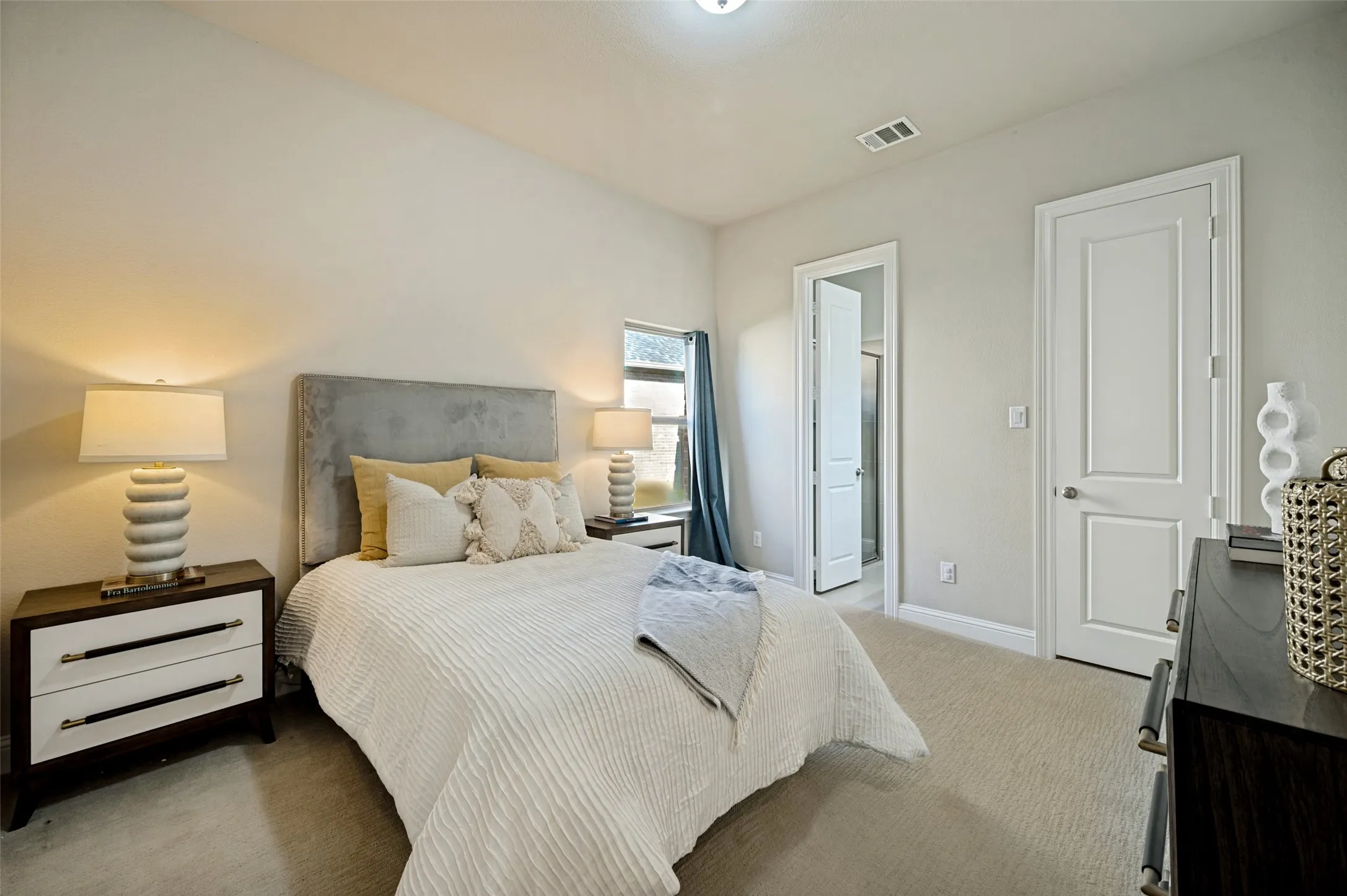 A well-appointed downstairs bedroom with a private ensuite bath offers exceptional comfort and flexibility for guests or multigenerational living. Thoughtfully positioned on the main level, this inviting retreat provides both privacy and convenience, creating a refined space ideal for overnight visitors or extended stays.