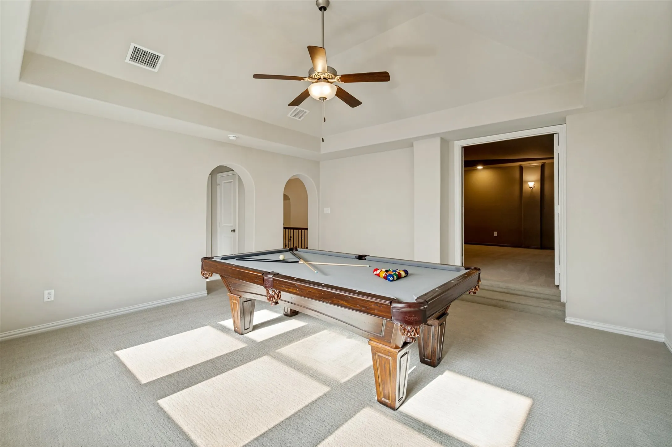 Upstairs, an expansive game room offers endless flexibility for entertaining, movie nights, or a private lounge space. With generous dimensions, abundant natural light, and direct access to the media room, this inviting retreat is perfectly designed for gathering, relaxing, and enjoying the home’s exceptional upper-level living space.
