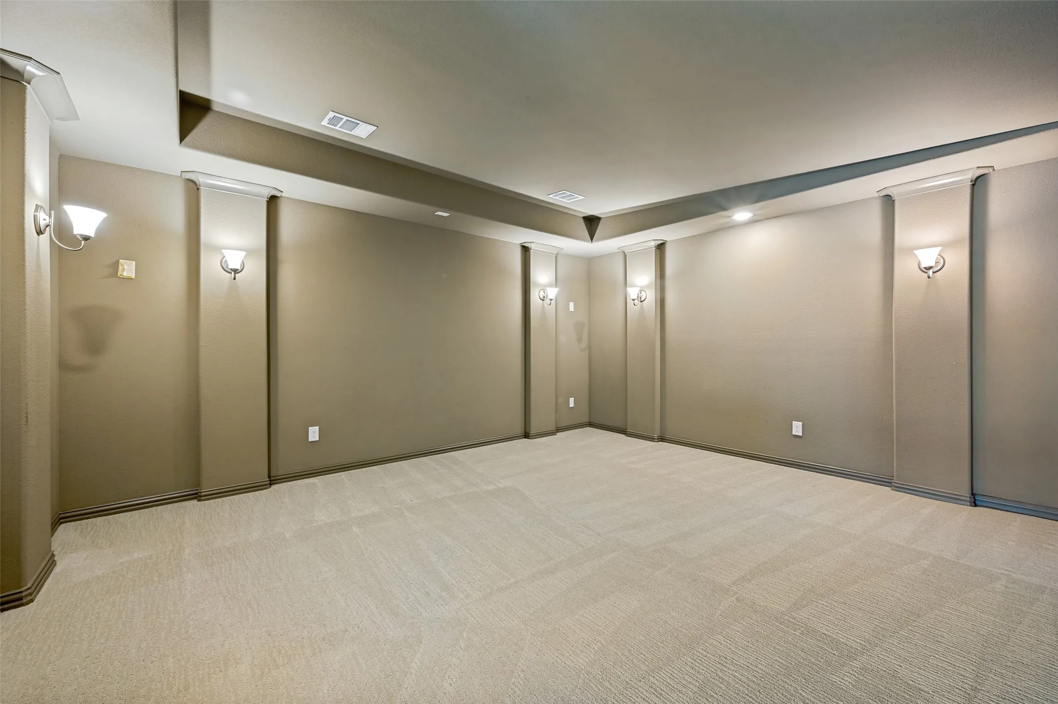 Designed for an immersive viewing experience, the dedicated media room offers the perfect space for movie nights, game-day gatherings, or private entertainment. With its spacious layout, elevated ceiling detail, and theater-style ambiance, this upper-level retreat adds another layer of luxury and versatility to the home’s exceptional living spaces.
