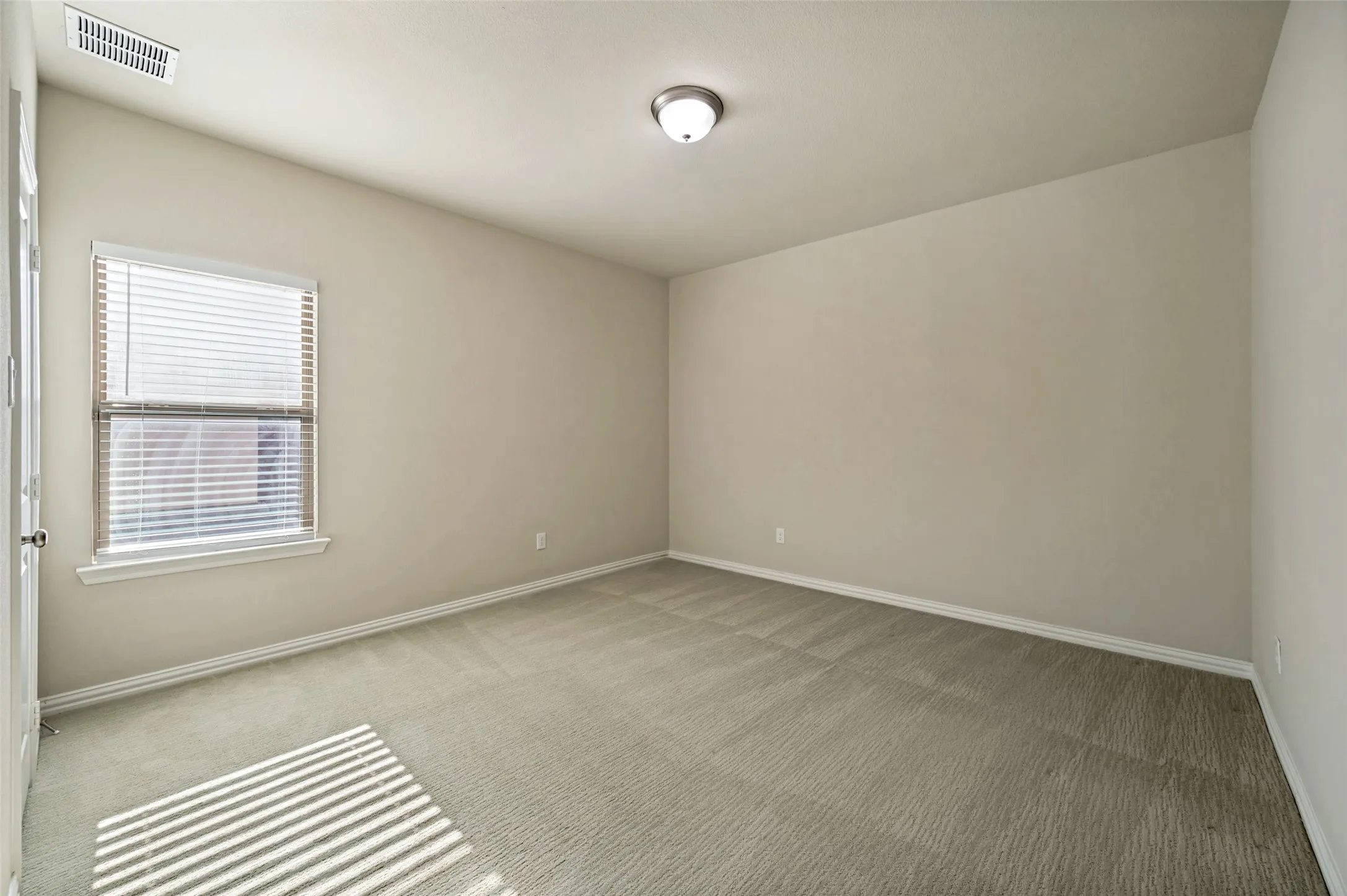 A spacious upstairs bedroom offers comfort, privacy, and versatility with soft natural light, generous proportions, and a neutral palette ready to suit a variety of needs. Ideal for family or guests, this inviting retreat provides a quiet upper-level escape with easy access to the home’s additional living spaces.