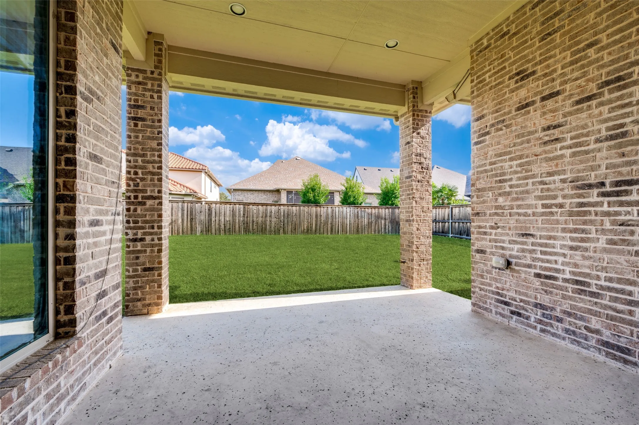 The covered patio extends your living space outdoors, offering a shaded setting for morning coffee, weekend grilling, or evening gatherings. Overlooking the spacious backyard, this inviting outdoor retreat provides plenty of room to relax now while still leaving endless possibilities for a future pool, play space, or custom outdoor entertaining area.