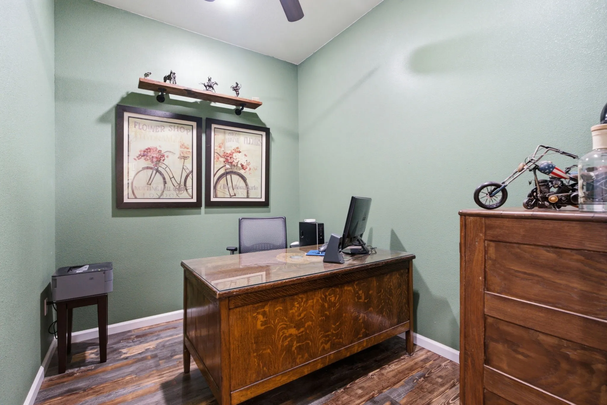 Wood-finish flooring with light green wall color