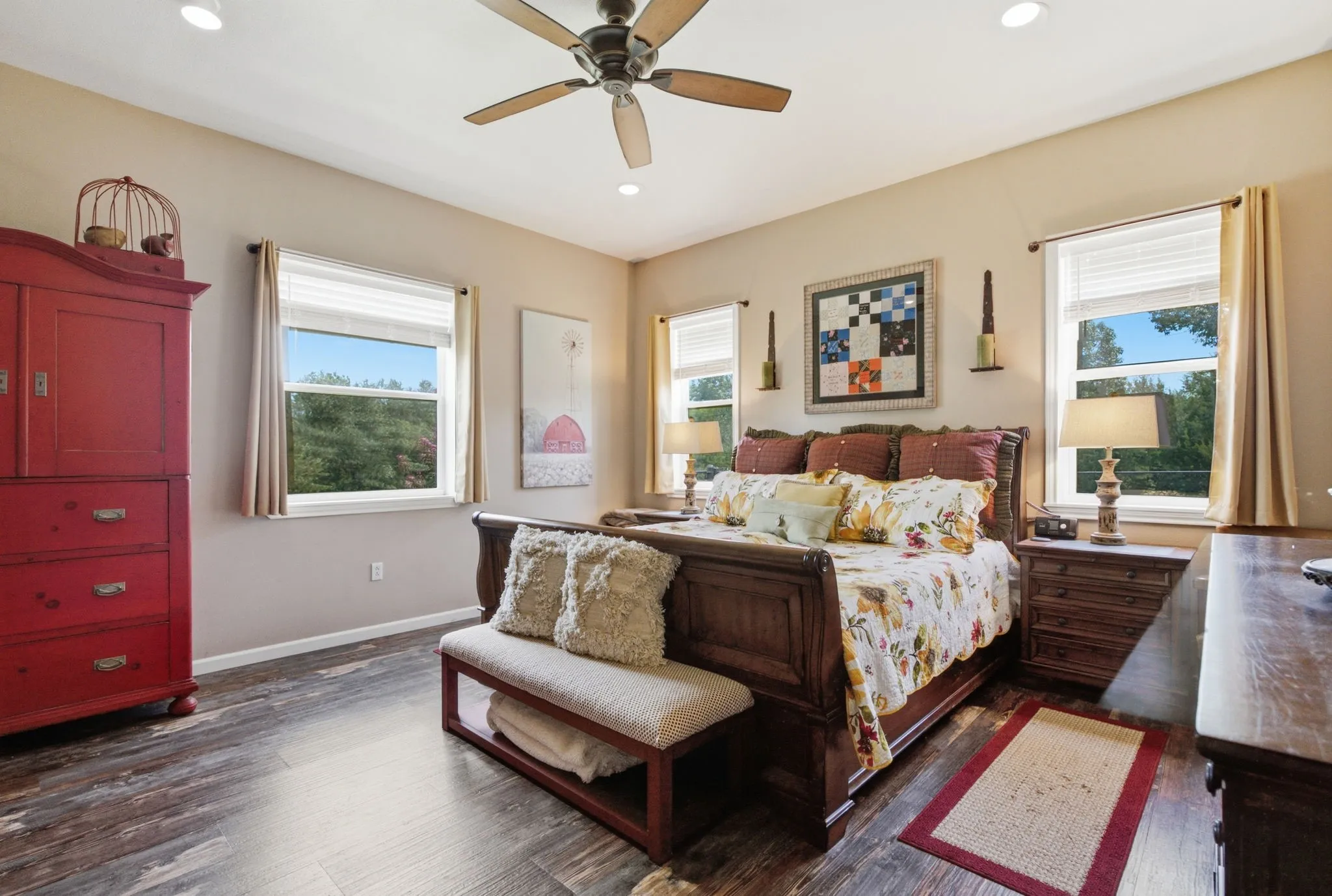 Recessed lighting, wood-finish flooring, ceiling fan, and multiple windows