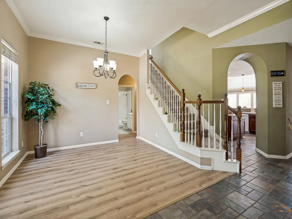 Foyer connect to formal dining, stairs and kitchen