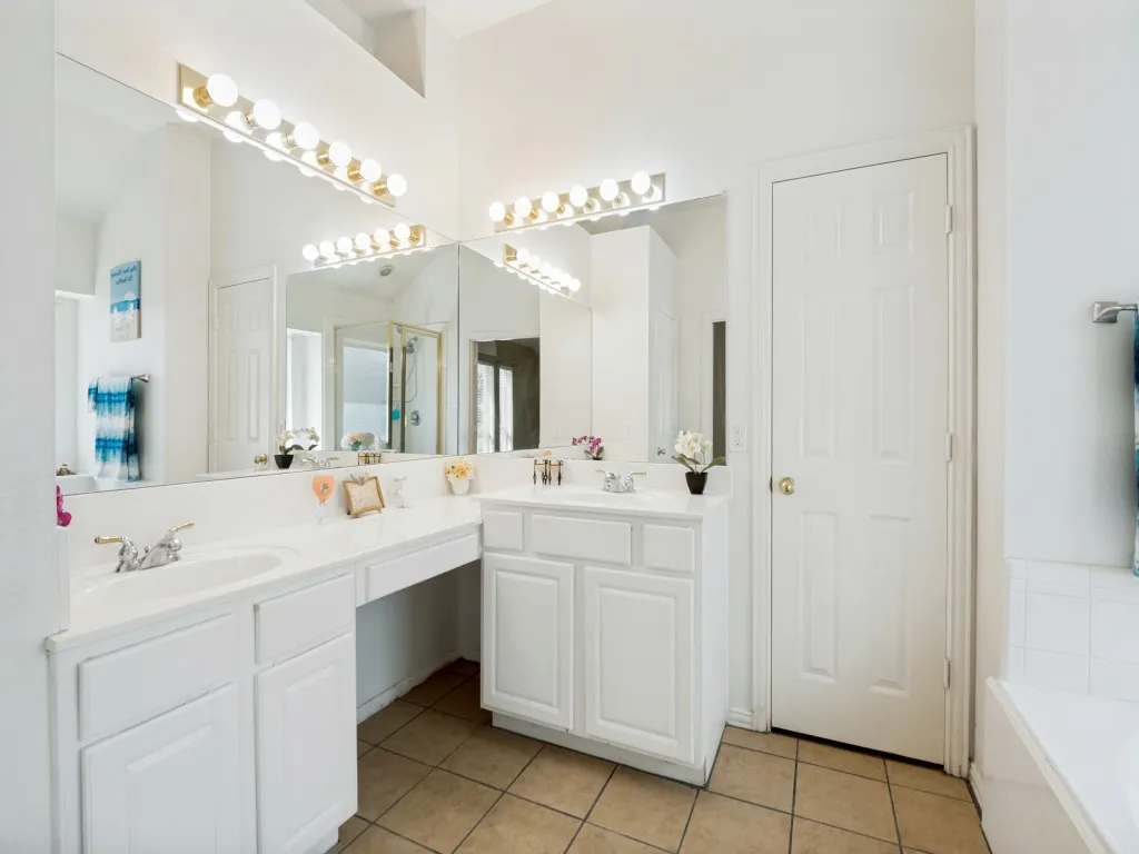 Primary bathroom with his and her vanities
