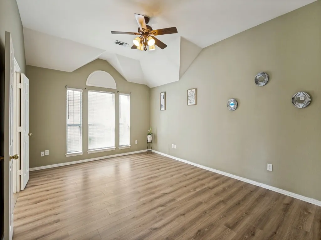 Large primary bedroom with enough space for a sitting area
