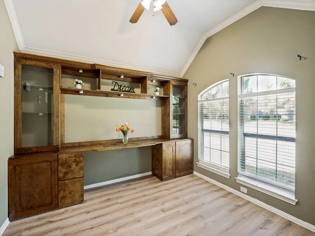 Office with built-in desk and shelves