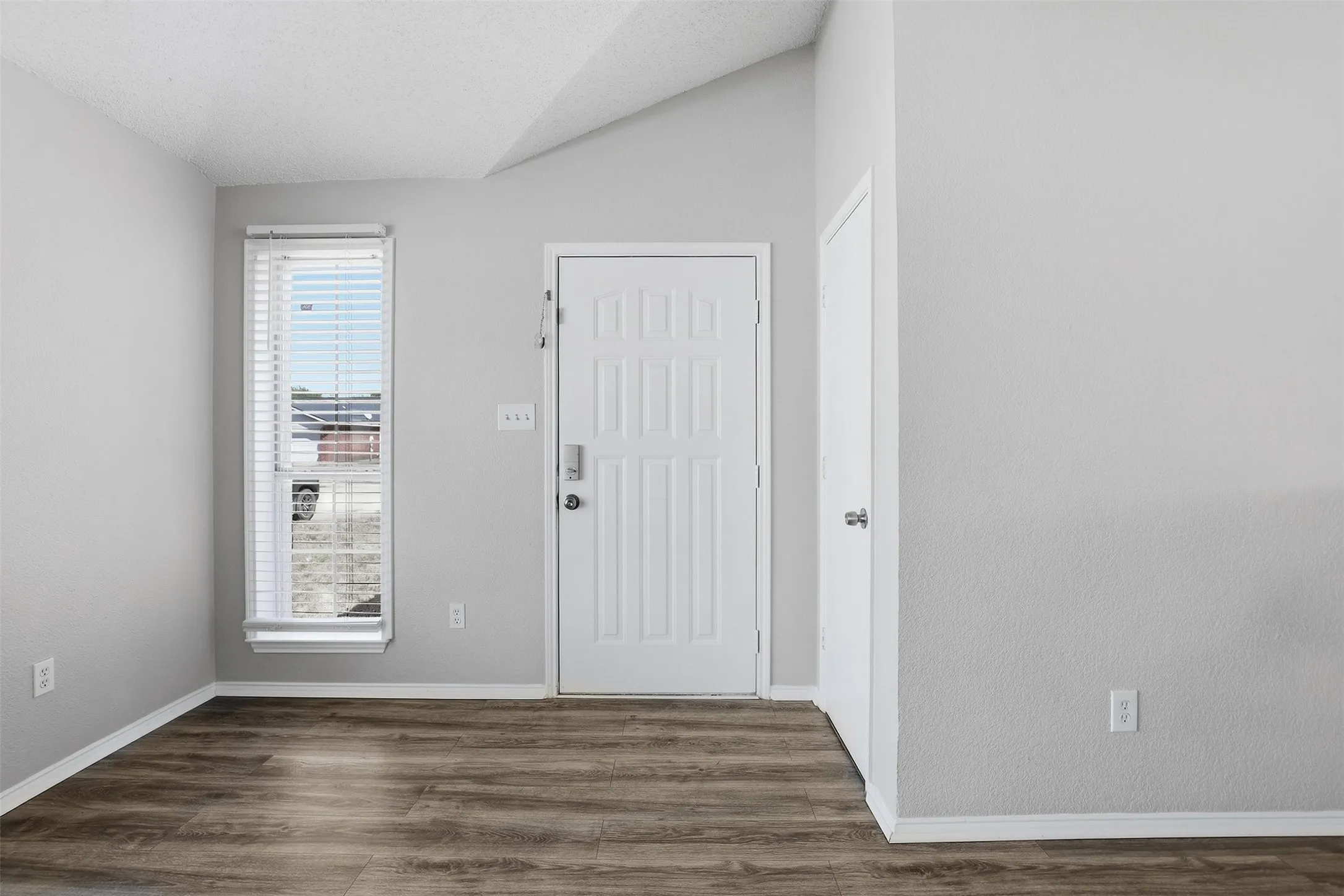 Wood-finish flooring with crisp white trim