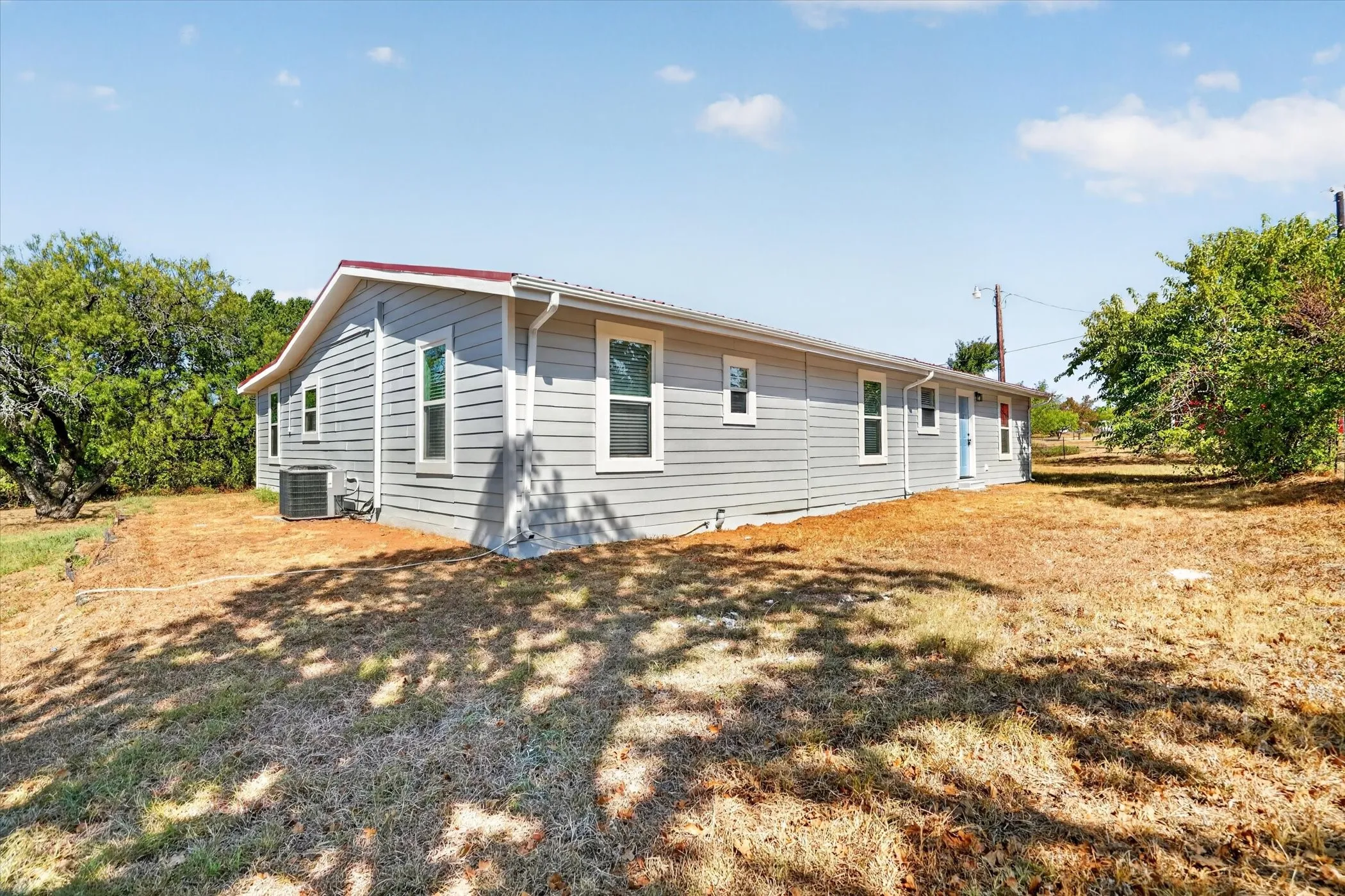 Light gray horizontal siding with white trim