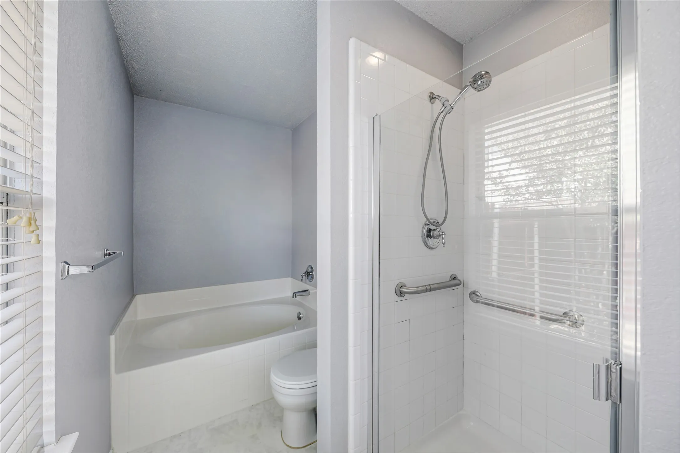 Separate garden tub and shower are great features of this Primary suite
