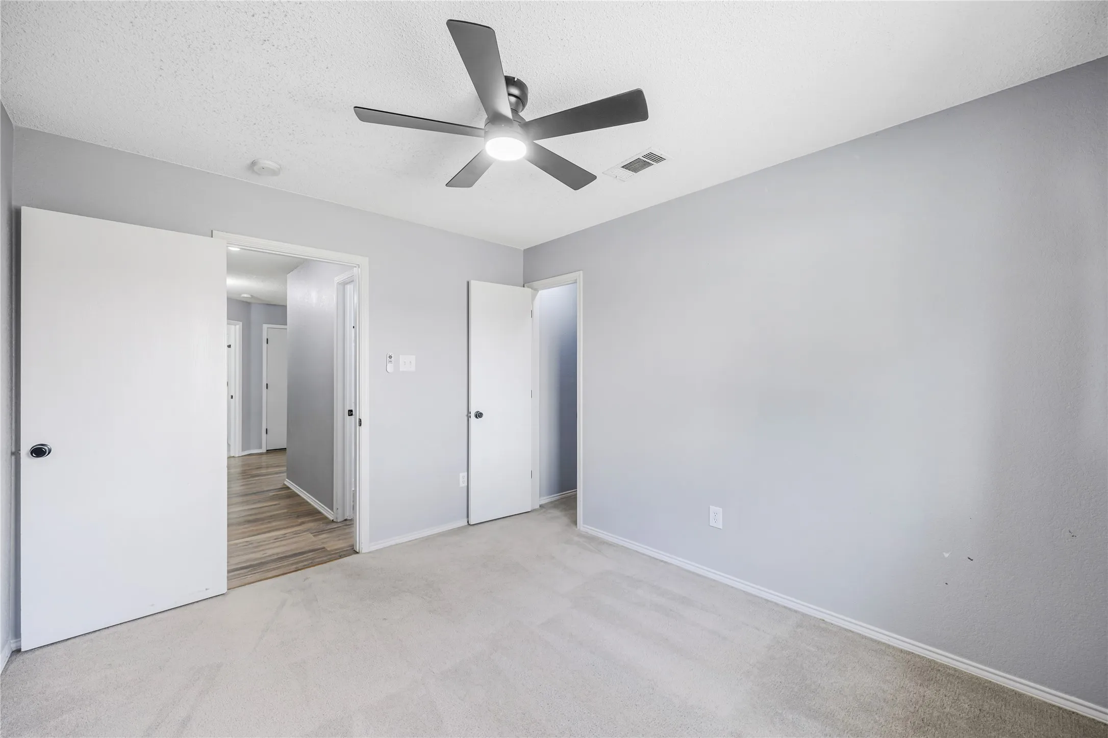 This secondary bedroom also features a large walk-in closet.