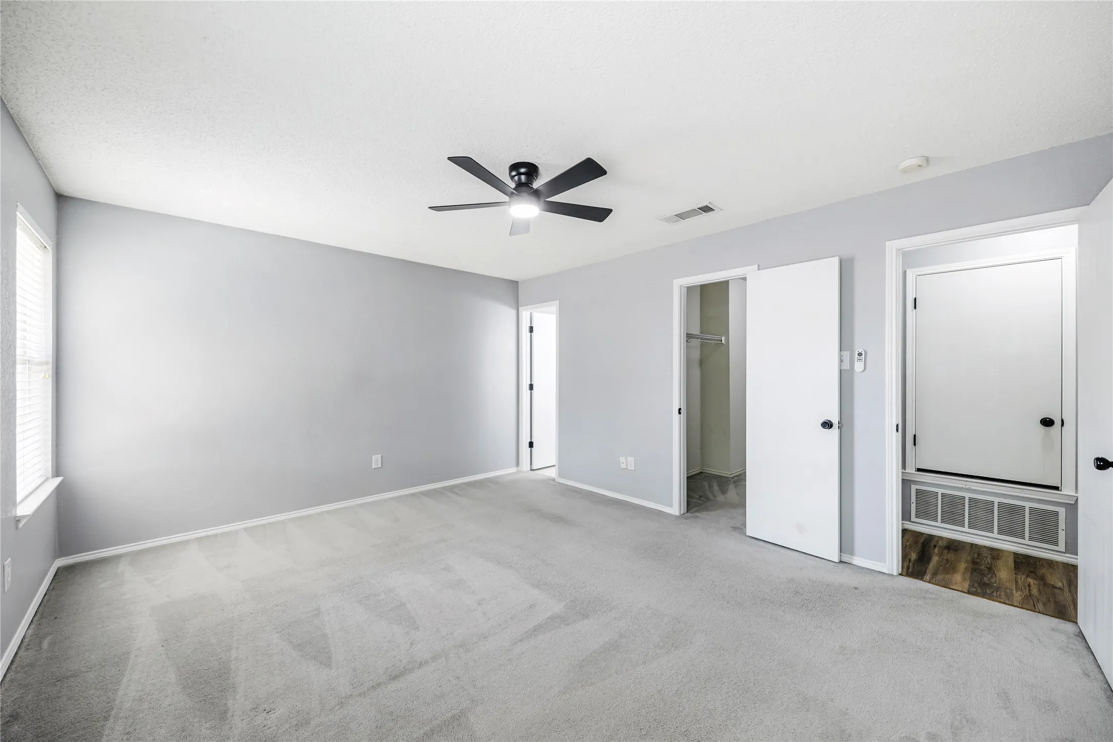 Another view of this large primary suite with a 11' walk-in closet and ensuite bathroom