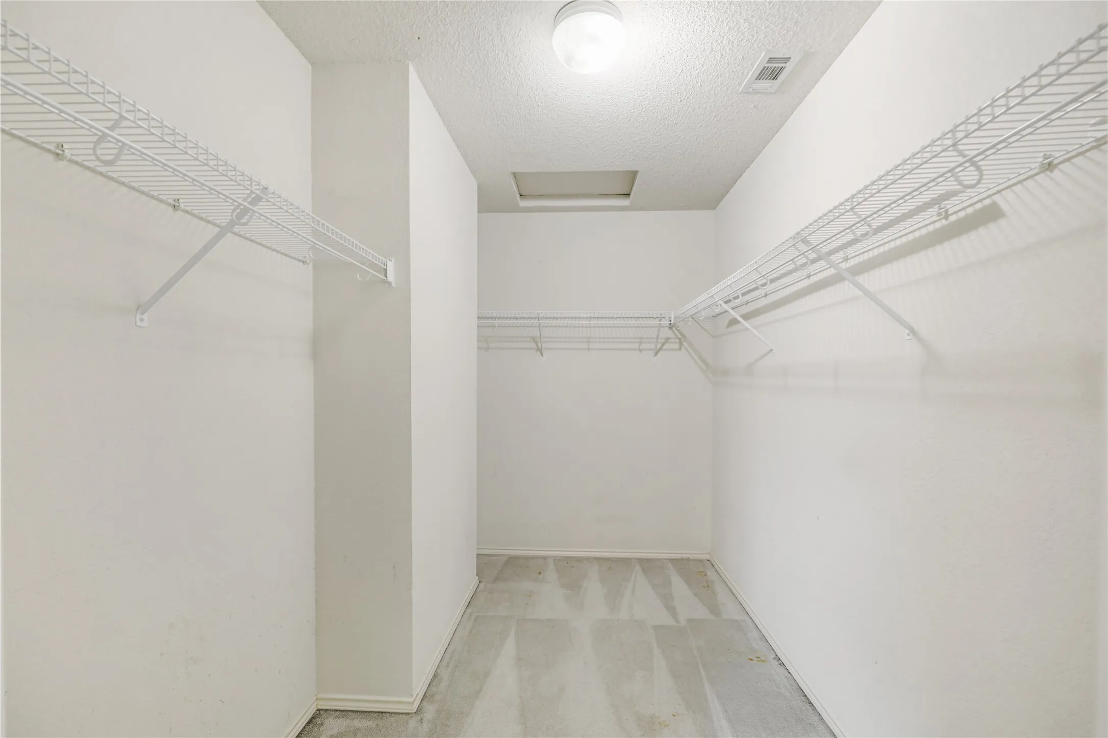 Take a look at this 11' walk-in closet in the primary suite