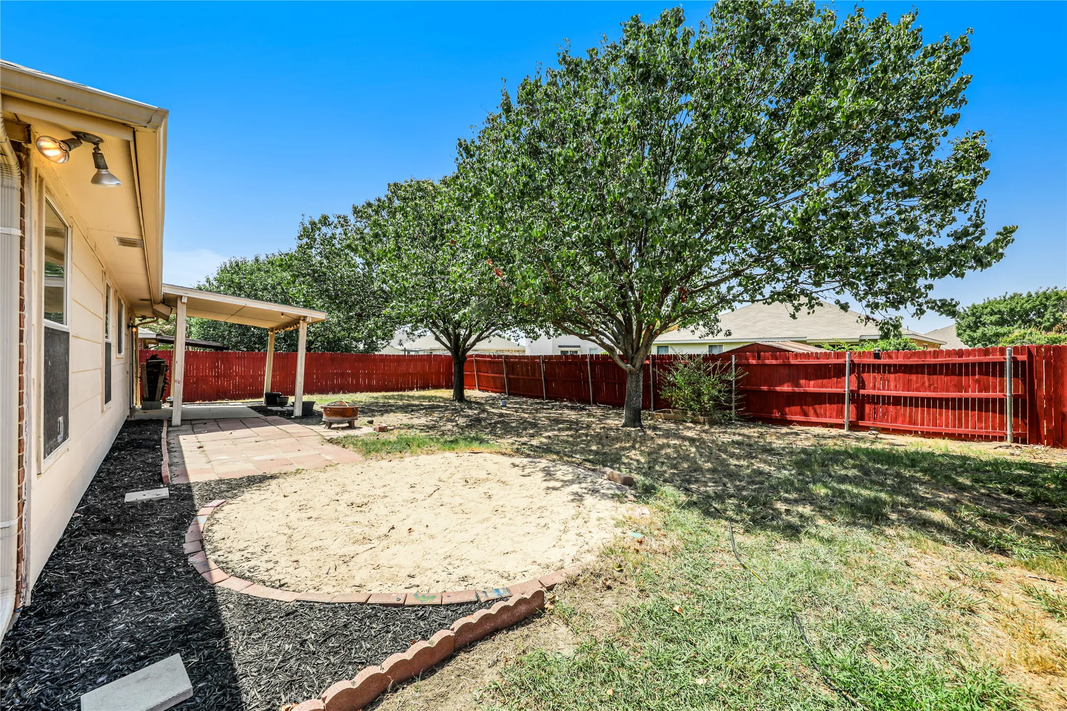 Kids will have fun in this sandbox just off the extended patio