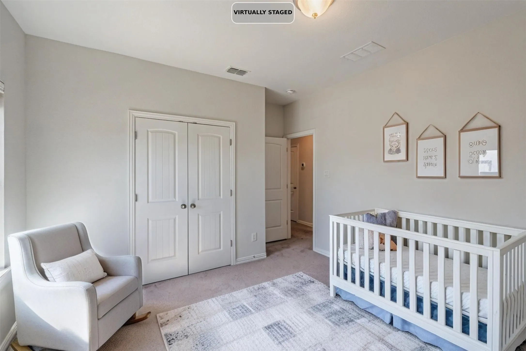 Carpeted flooring, light neutral wall paint, and white trim throughout