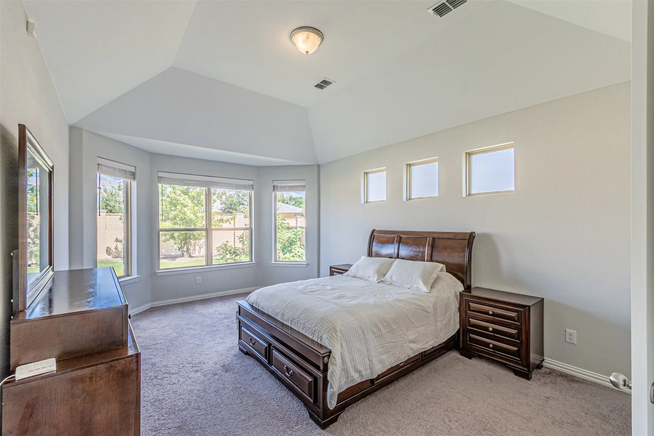 Vaulted ceiling with an overhead light fixture