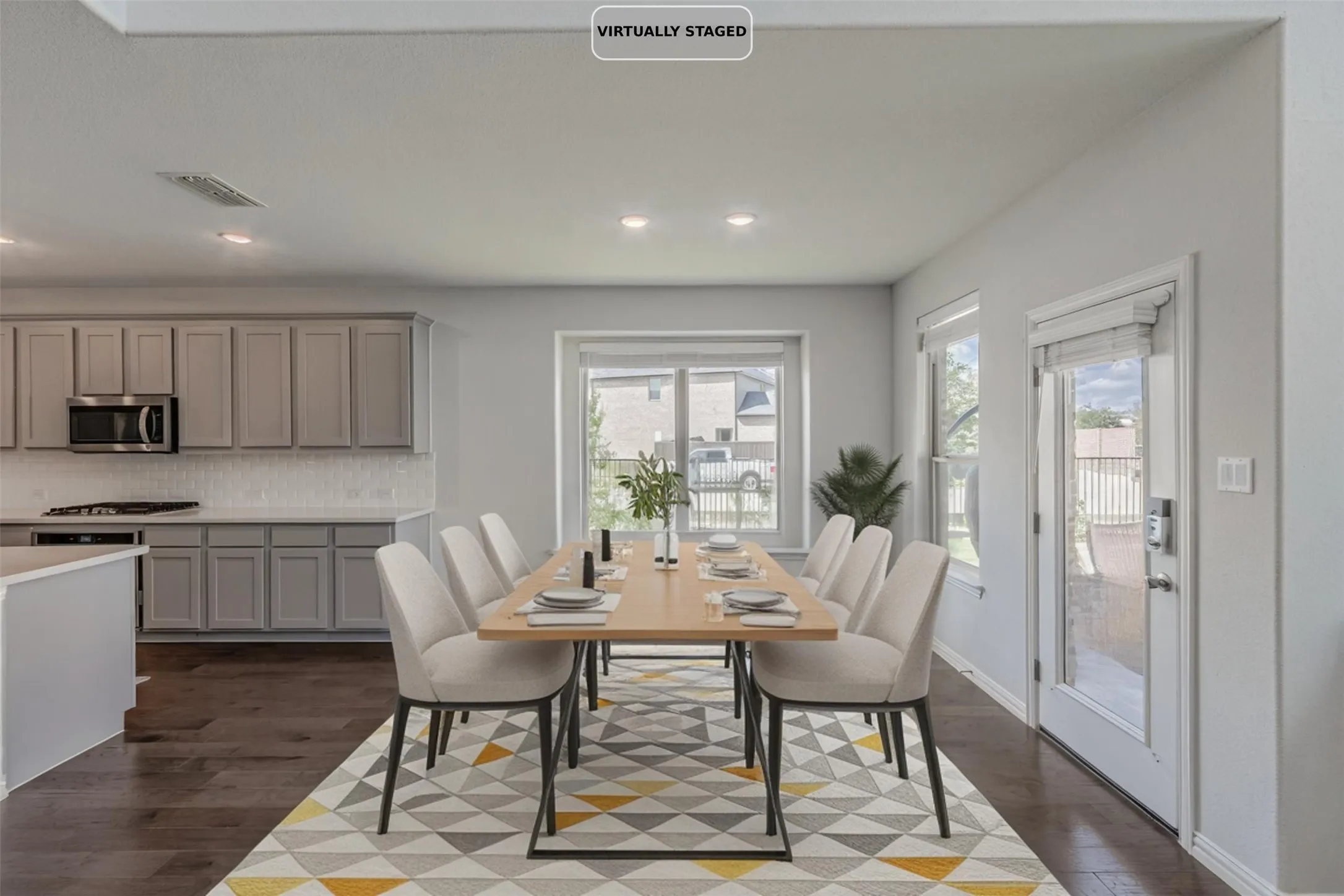 Open-concept layout featuring recessed lighting and wood-finish flooring