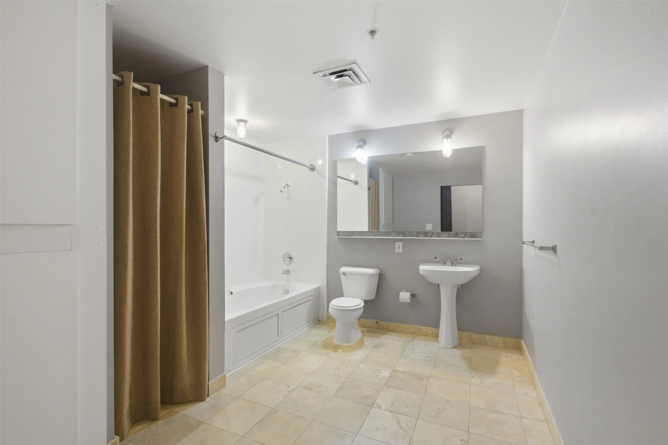 Bathroom has lots of space to add decorative storage pieces.