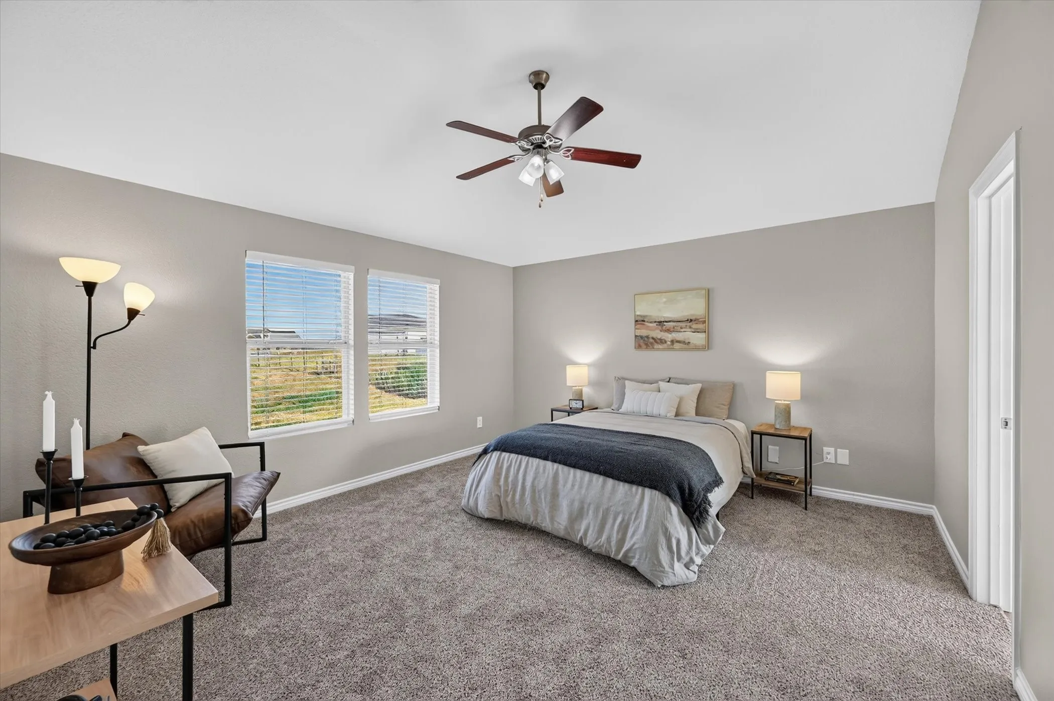 Neutral-toned walls complement the gray carpeting