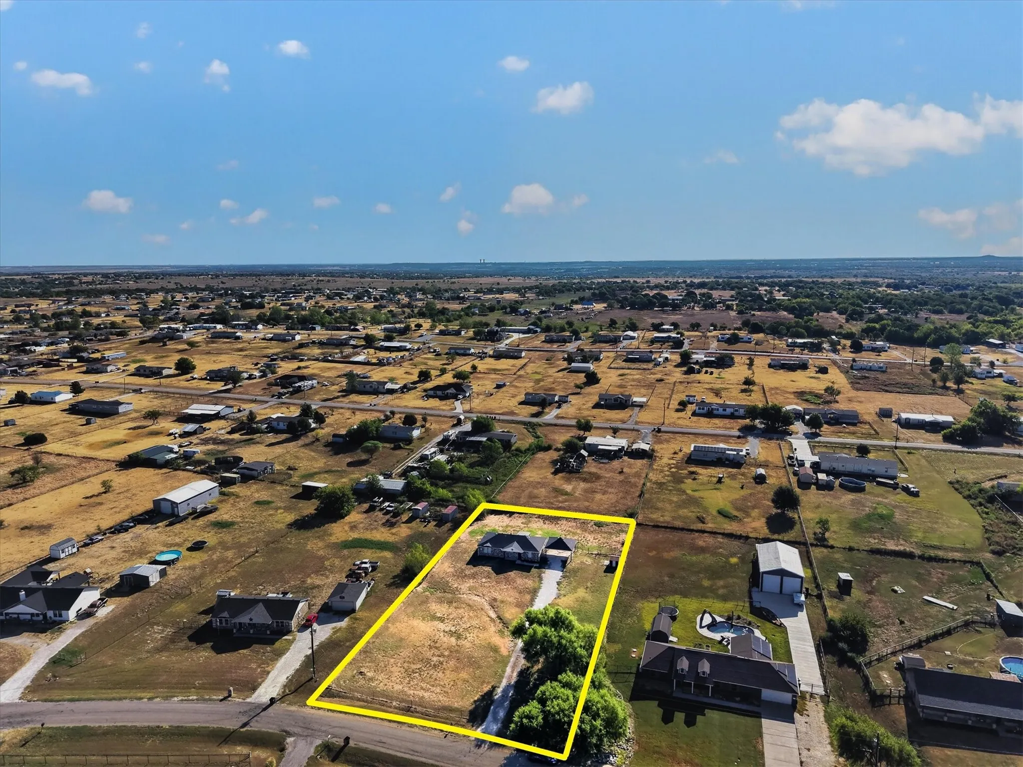 Aerial view of a residential property with a defined boundary