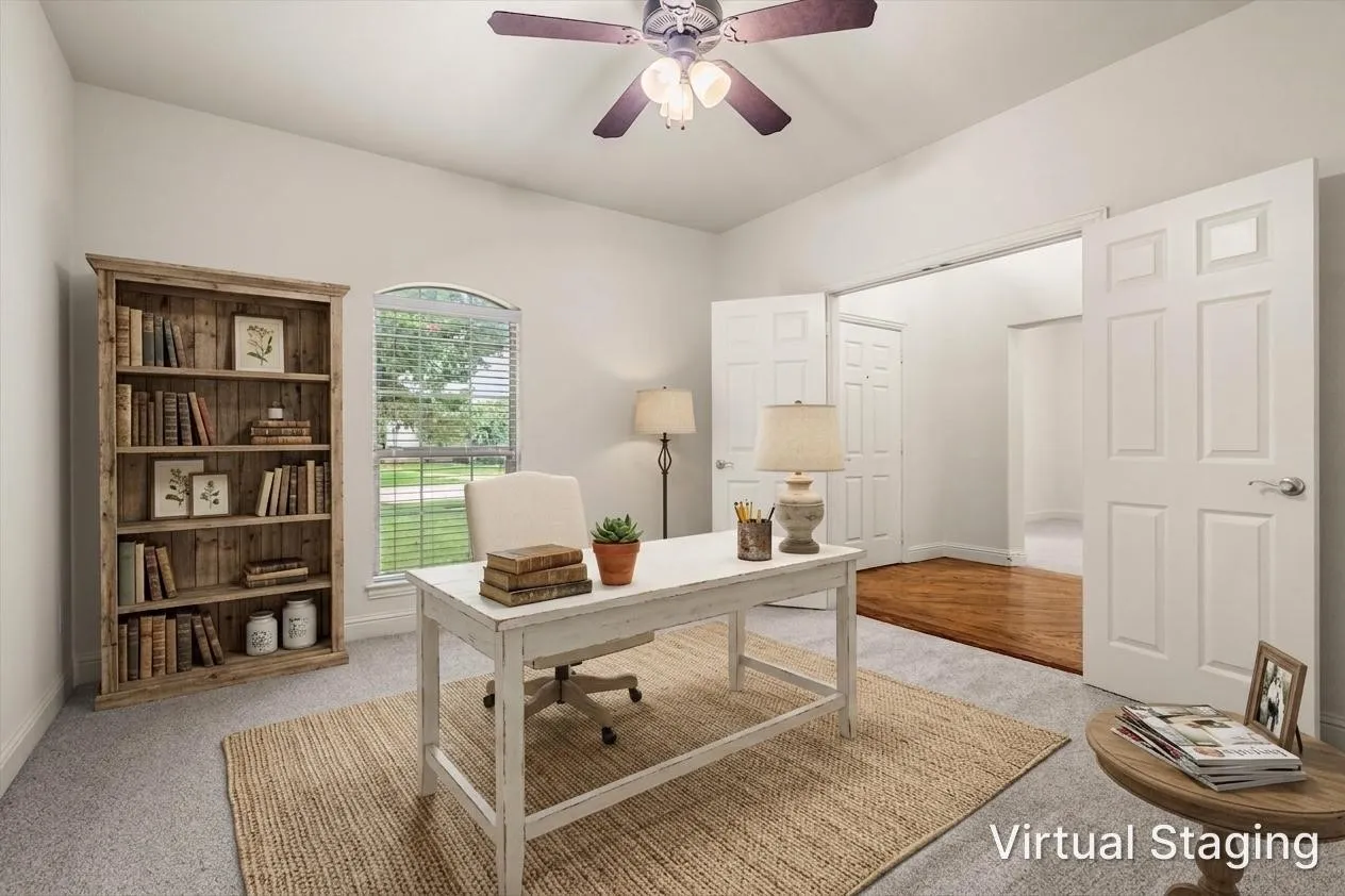 Flex room styled as a home office with built-in shelving and desk