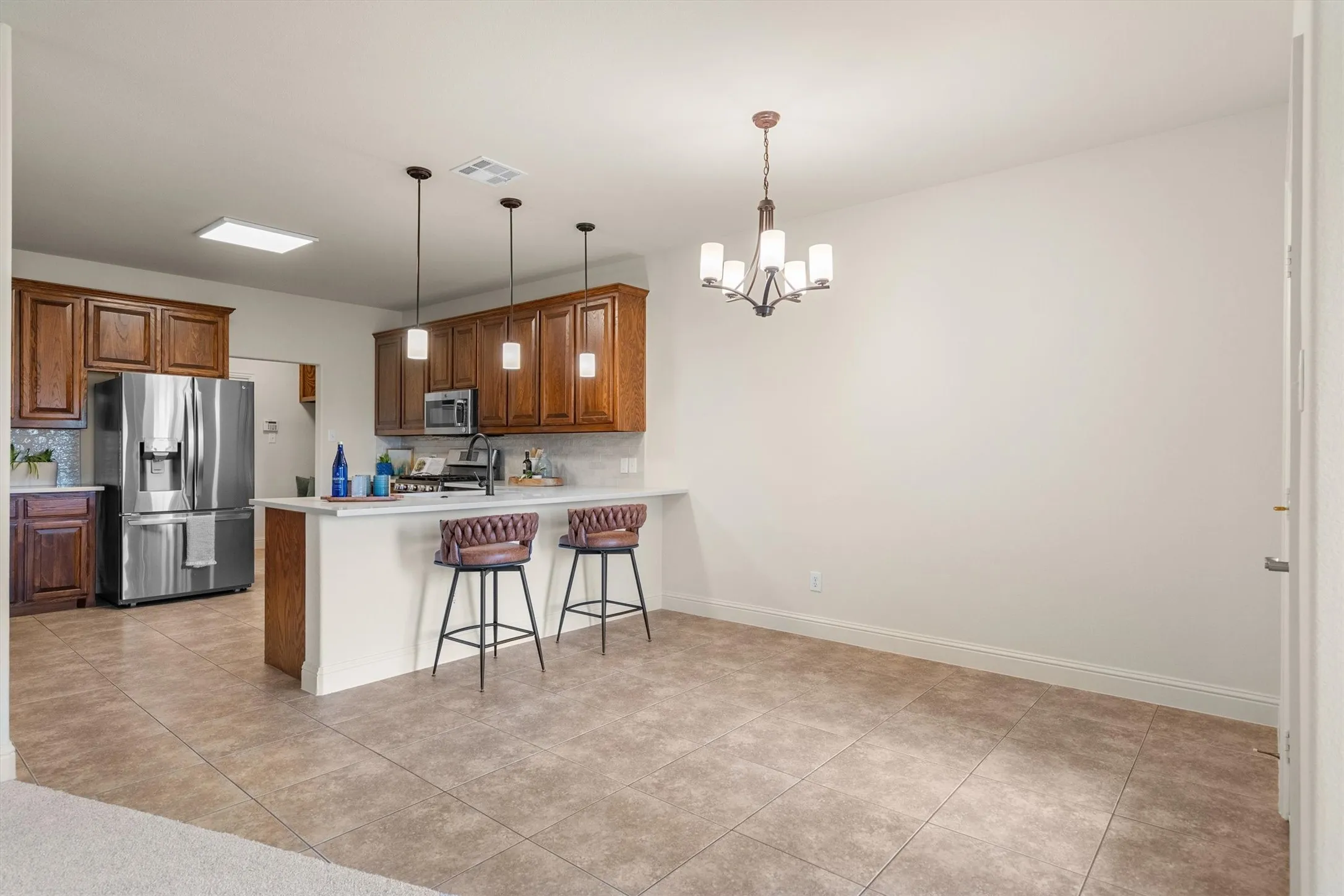 Kitchen with bar seating overlooking the living area — perfect for entertaining