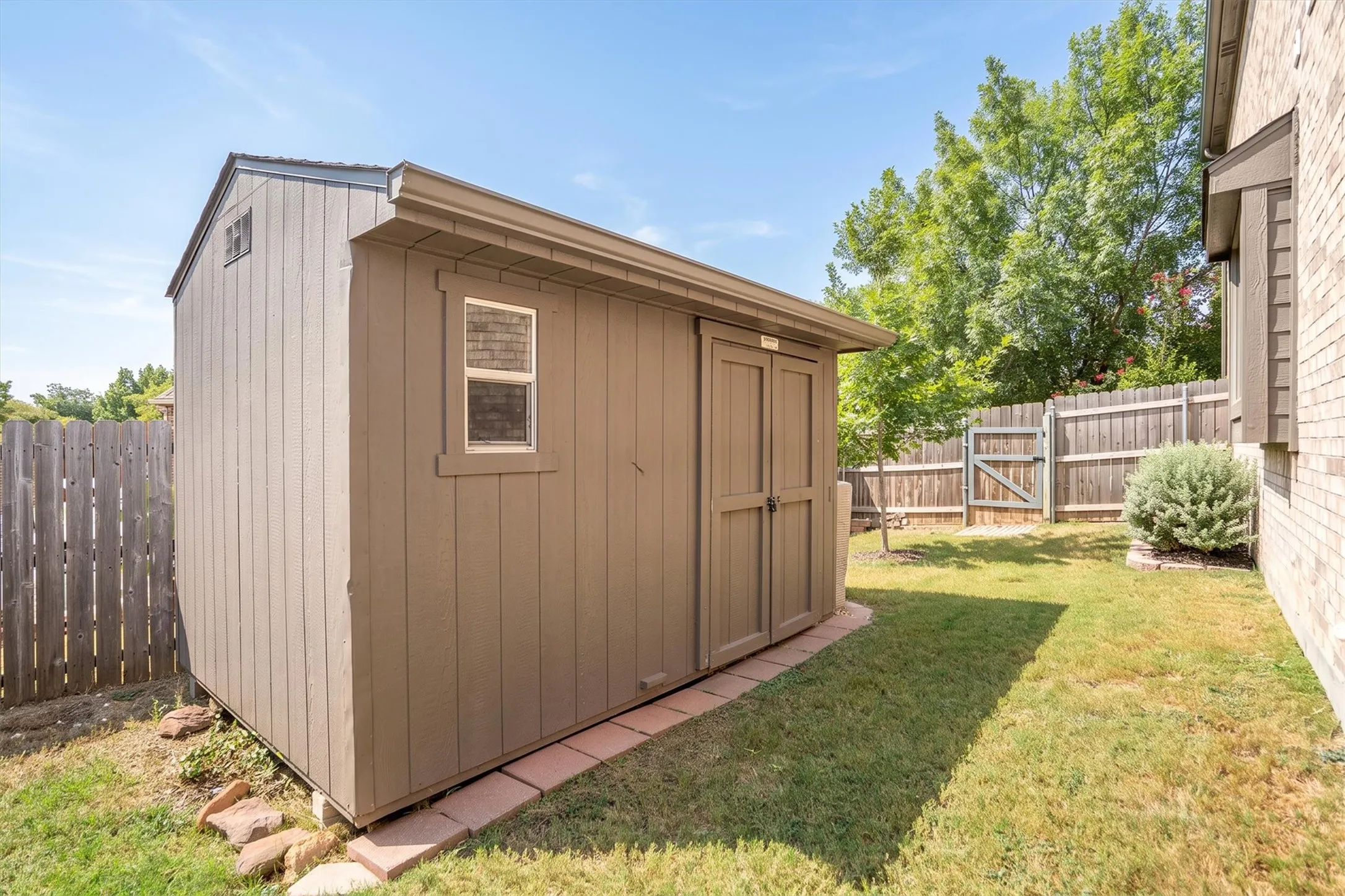 Backyard storage shed — great for tools, lawn equipment, or extra storage